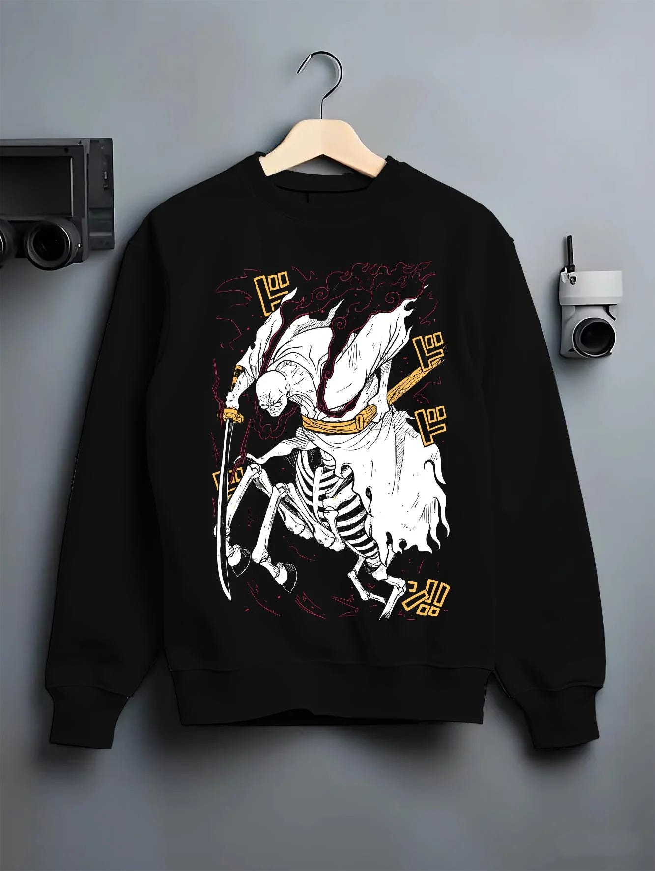 Black crewneck sweatshirt on hanger with One Piece Hoodie Brook Soul King Rising Jumper graphic streetwear graphic.