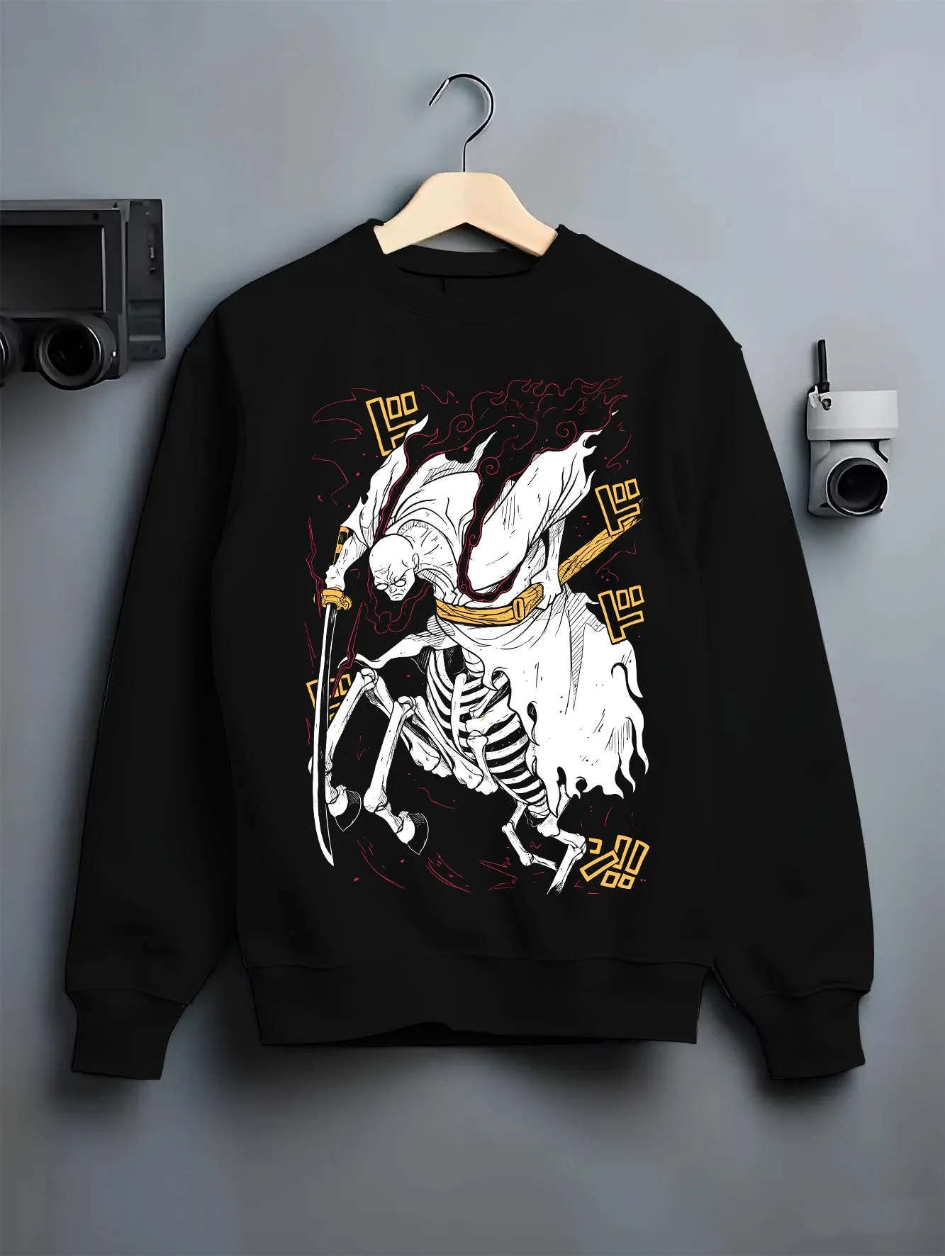 Black crewneck sweatshirt on hanger with One Piece Hoodie Brook Soul King Rising Jumper graphic streetwear graphic.