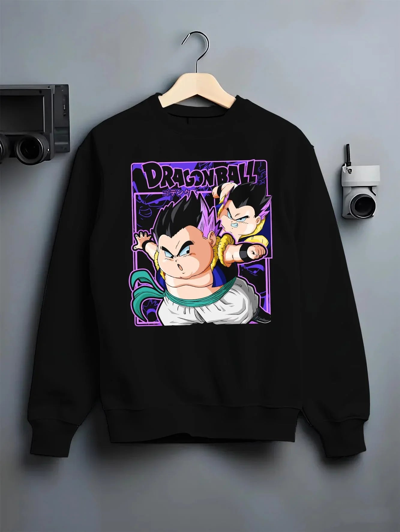 Black crewneck sweatshirt on hanger with Dragon Ball Z Hoodie Goten Trunks Fusion Dance Jumper graphic bold anime graphic.