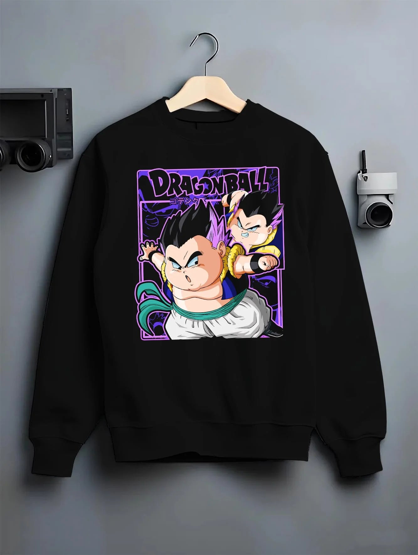Black crewneck sweatshirt on hanger with Dragon Ball Z Hoodie Goten Trunks Fusion Dance Jumper graphic bold anime graphic.
