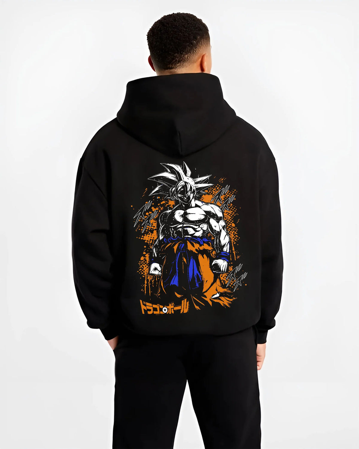 Black hoodie model back view showing Goku from Dragon Ball: dark Ultra Instinct-style power-up ( form)
