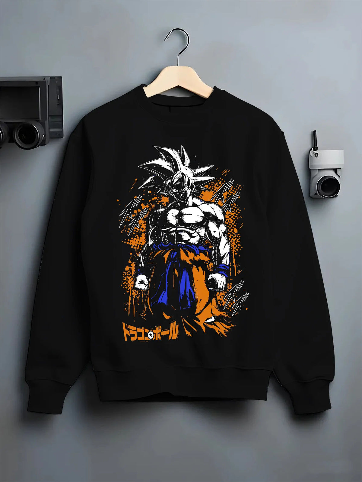 Black crewneck sweatshirt on hanger showing Goku from Dragon Ball: dark Ultra Instinct-style power-up ( form)
