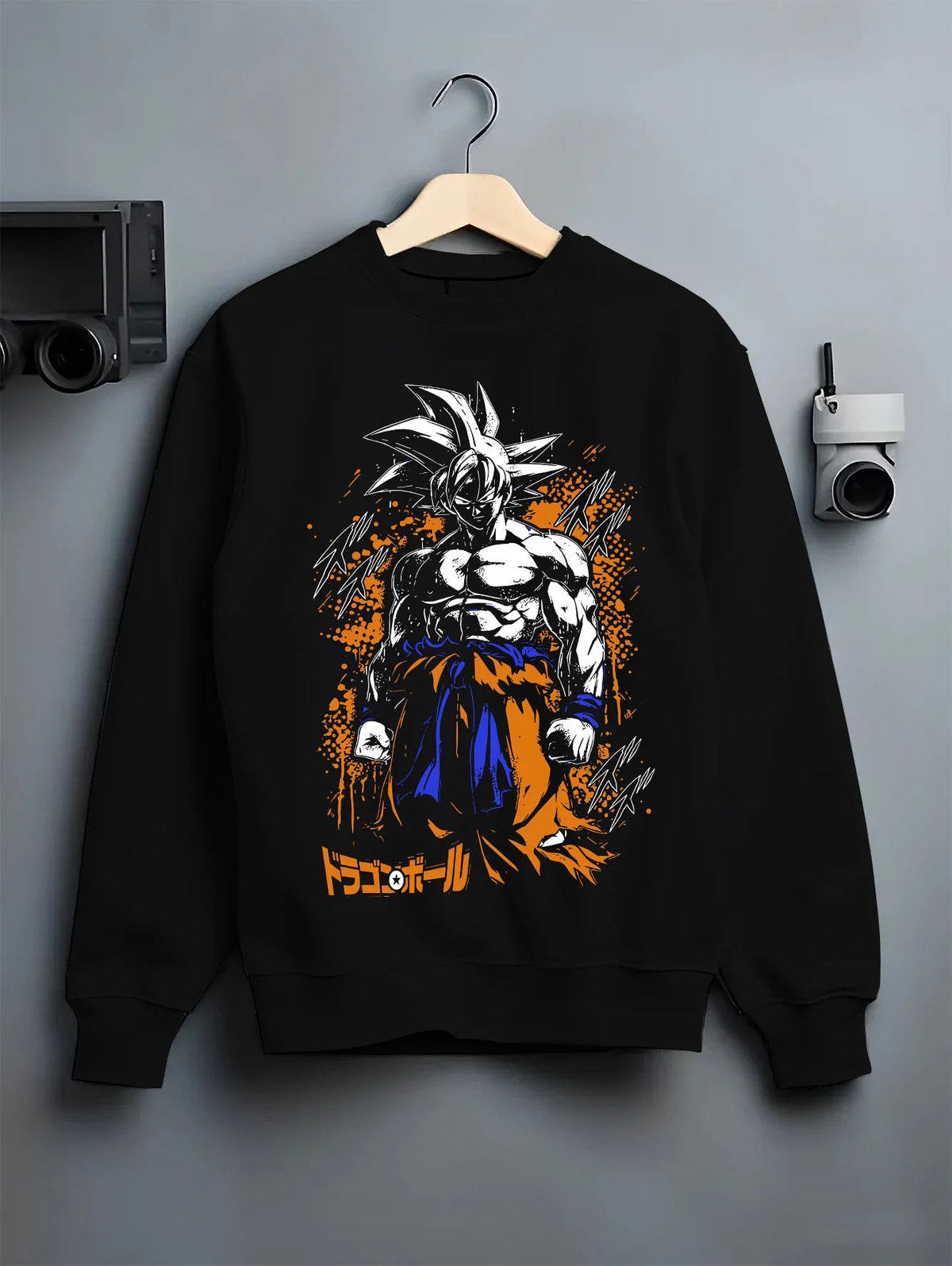 Black crewneck sweatshirt on hanger showing Goku from Dragon Ball: dark Ultra Instinct-style power-up ( form)