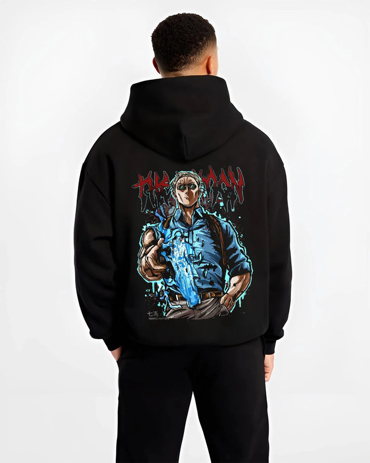 Black hoodie worn by male model, back view, showing anime poster inspired Nanami design in striking blue and bold streetwear style.