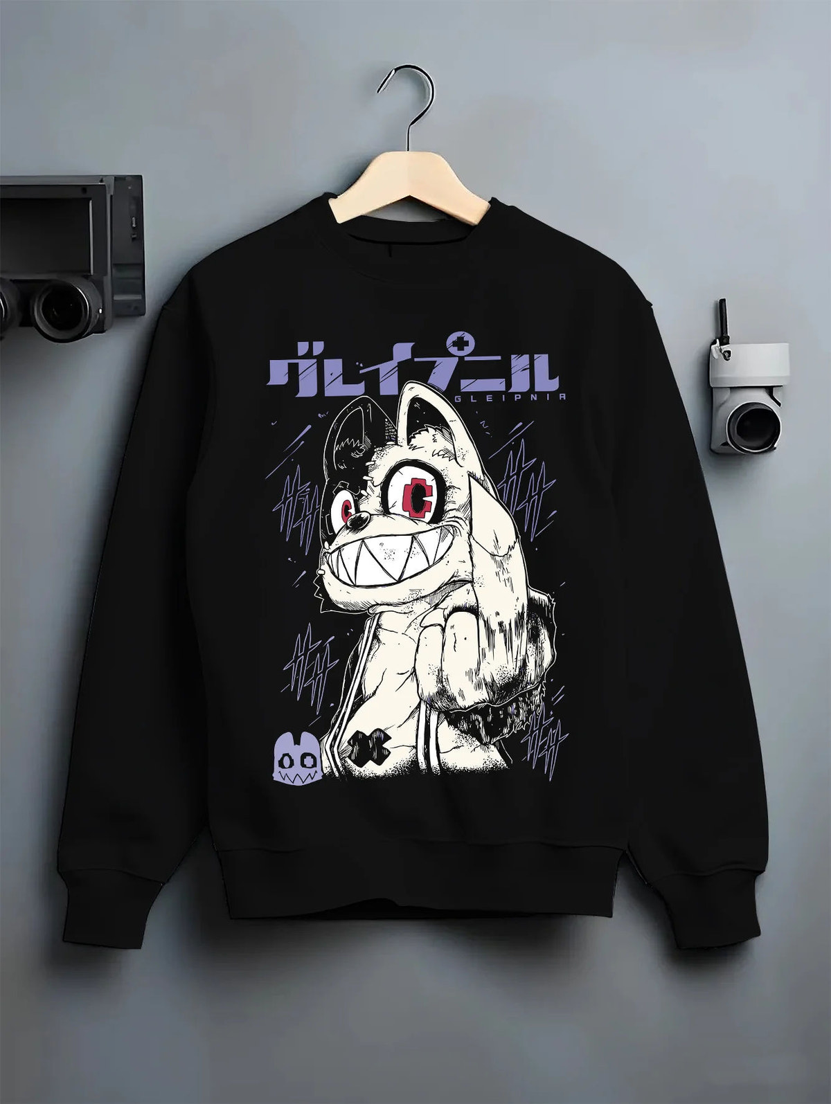 Black crewneck sweatshirt on hanger showing Gremlin / Stripe-like creature from Gremlins: Gremlins movie character