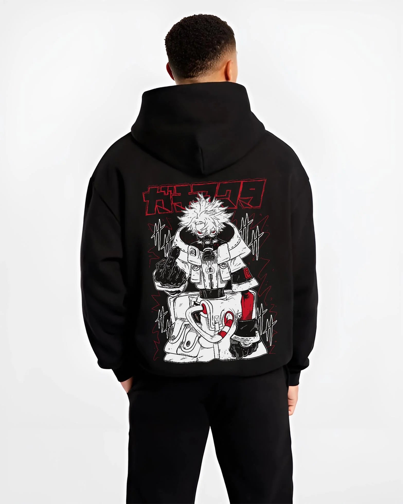 Black hoodie worn by male model, back view, showcasing Rudo Gachiakuta Japanese animation streetwear design with bold dark manga panel graphic.