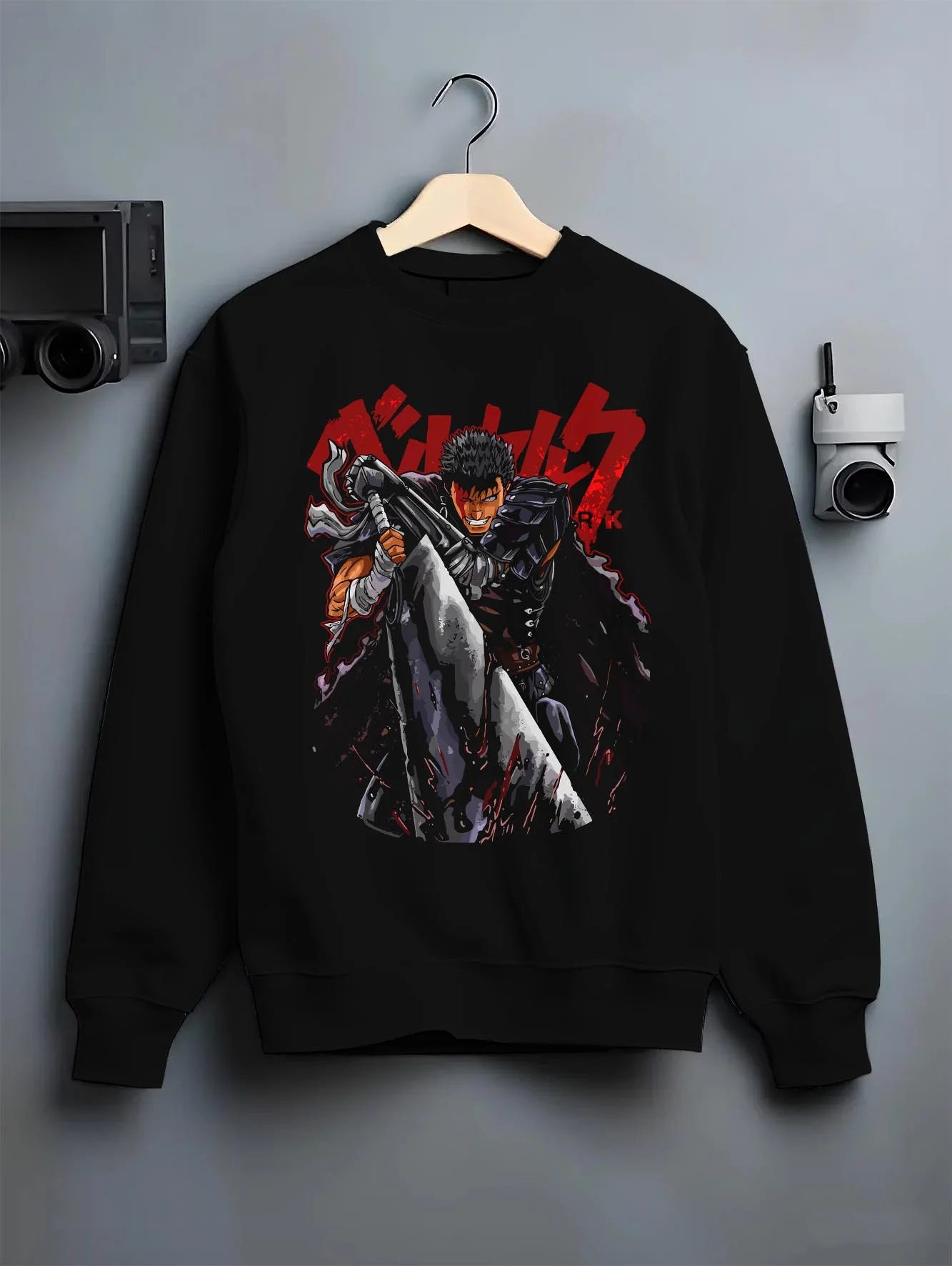 Black crewneck sweatshirt on hanger with Guts Berserk Warrior Hoodie Dark Fantasy Retro Anime graphic premium wear.