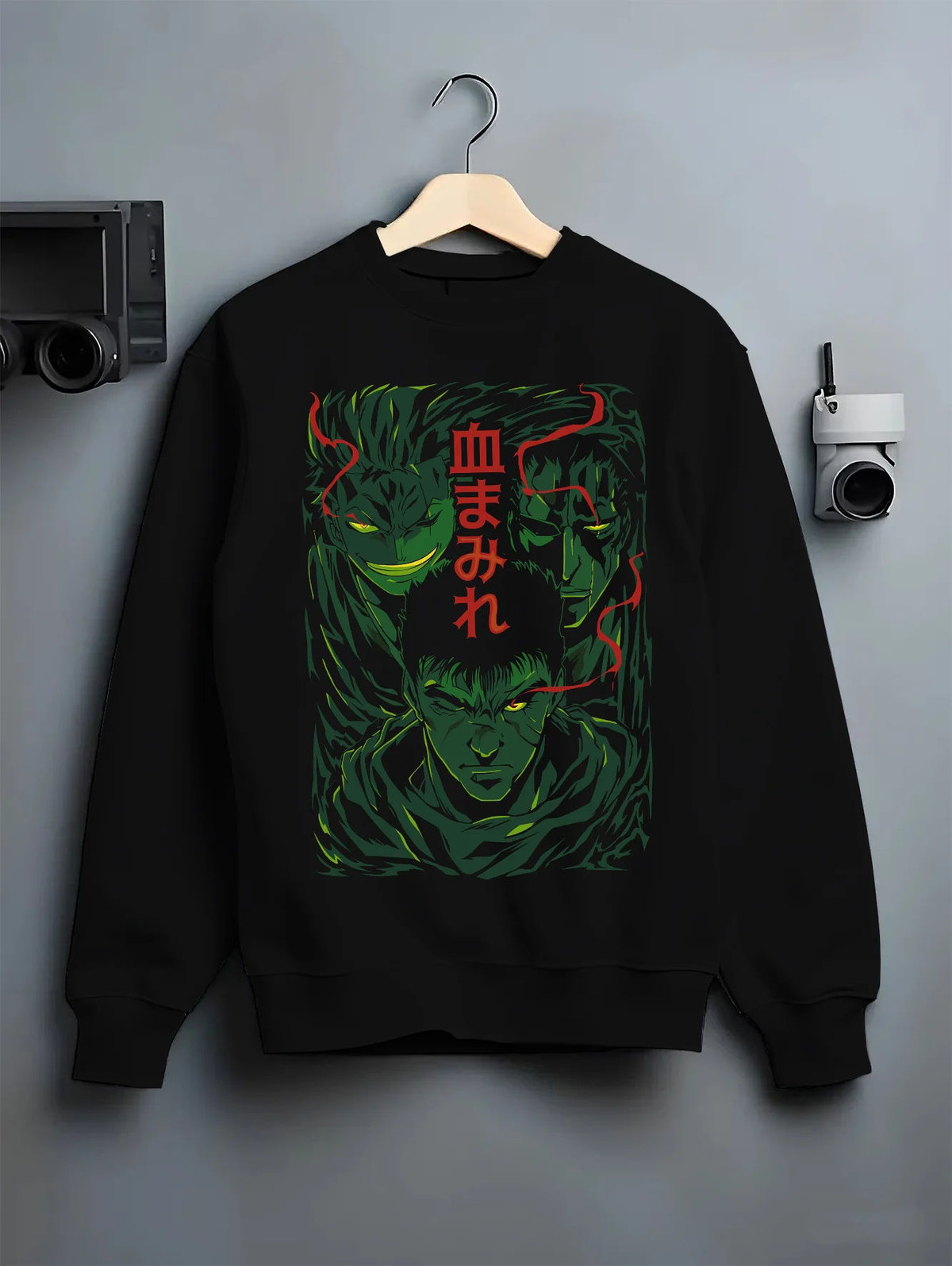 Black crewneck sweatshirt on hanger with Berserk dark-haired warrior in green/red portrait illustrated back graphic