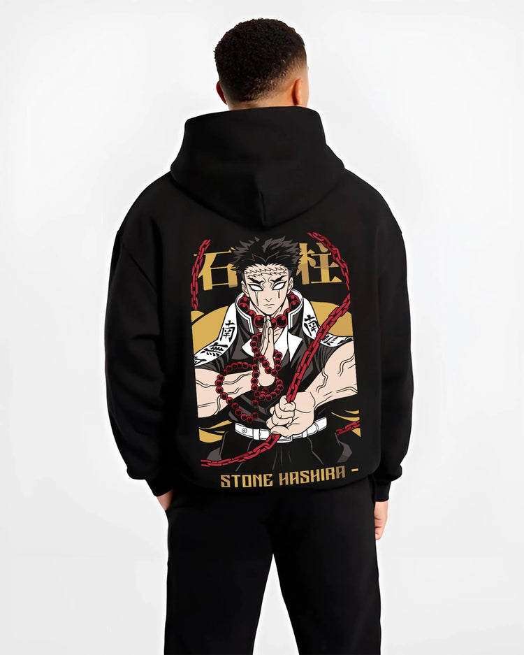 Black hoodie worn by male model from the back featuring Gyomei Himejima Stone Hashira prayer artwork.