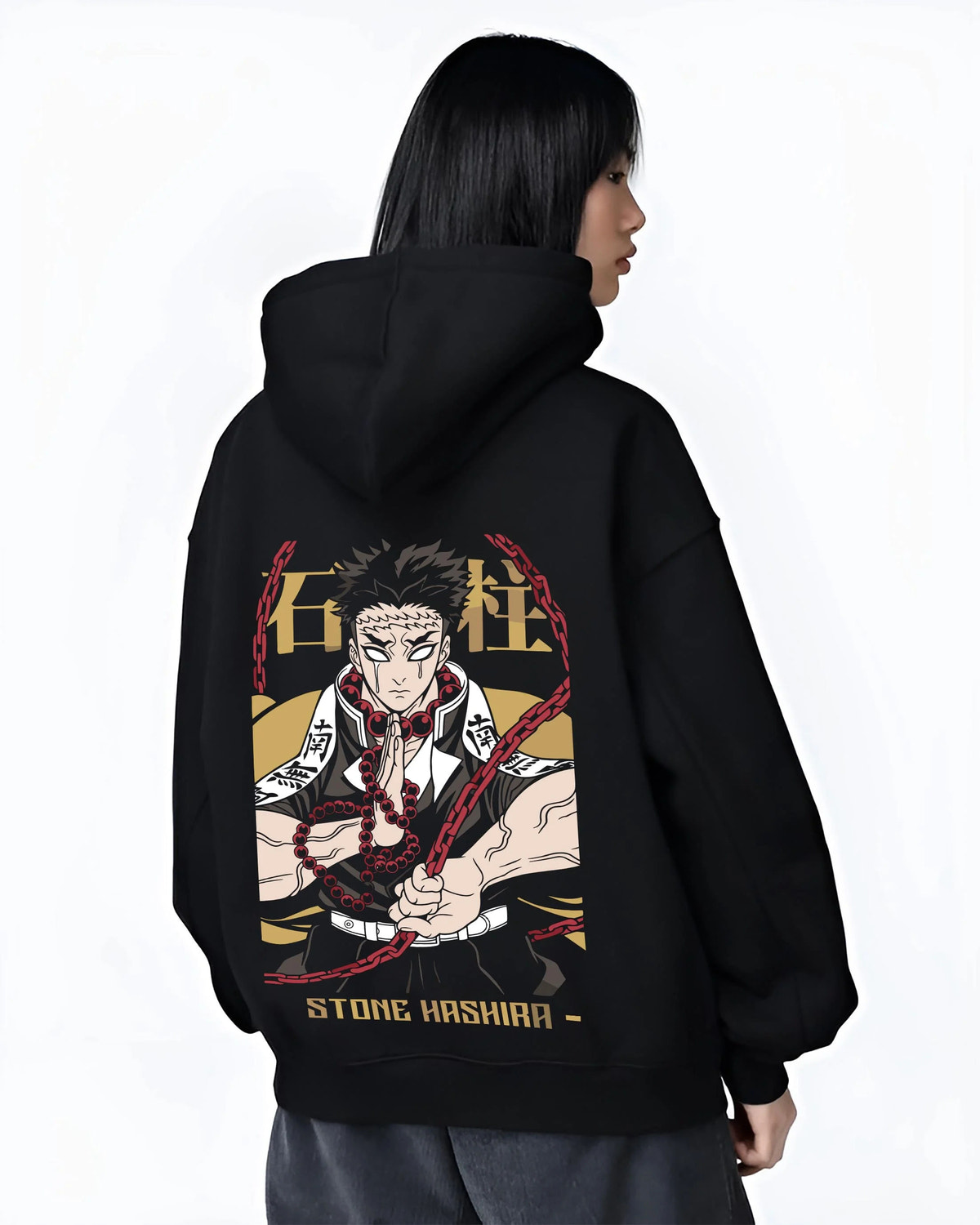 Black hoodie worn by female model from the back featuring Gyomei Himejima Stone Hashira prayer artwork.