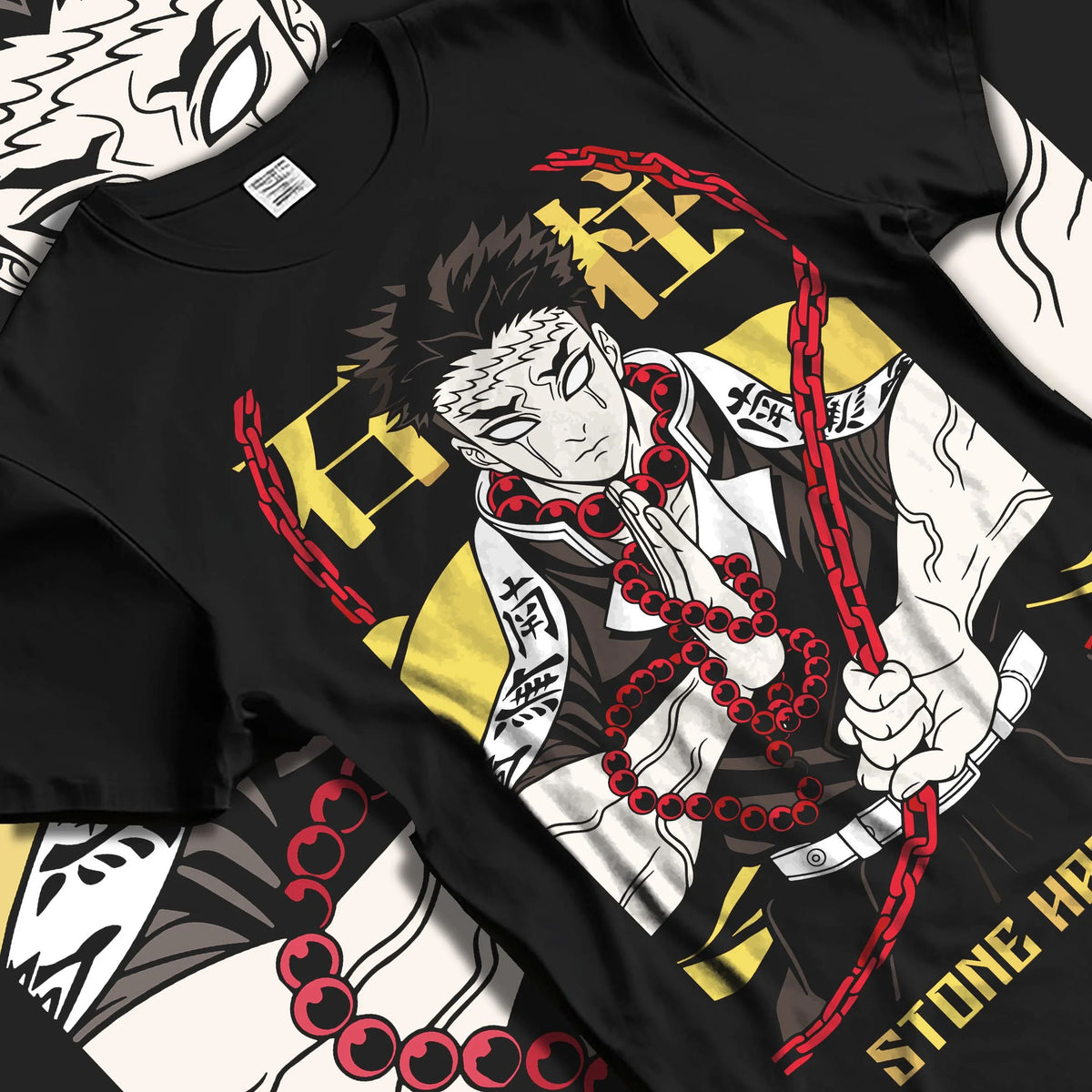 Black T-shirt laid flat with natural folds featuring Gyomei Himejima Stone Hashira prayer artwork.