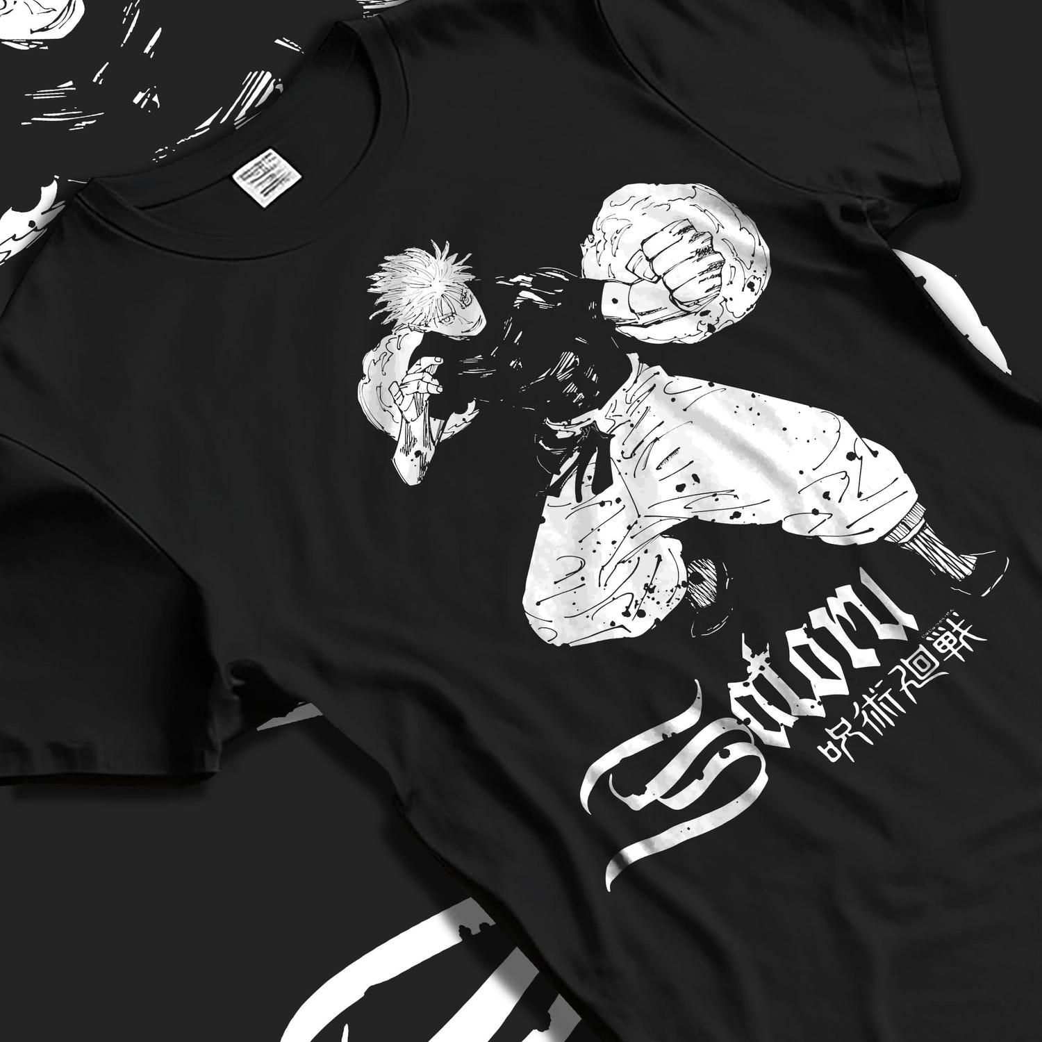 Black T-shirt laid flat with natural fabric folds, featuring shonen battle character artwork of Satoru in a bold retro manga graphic.