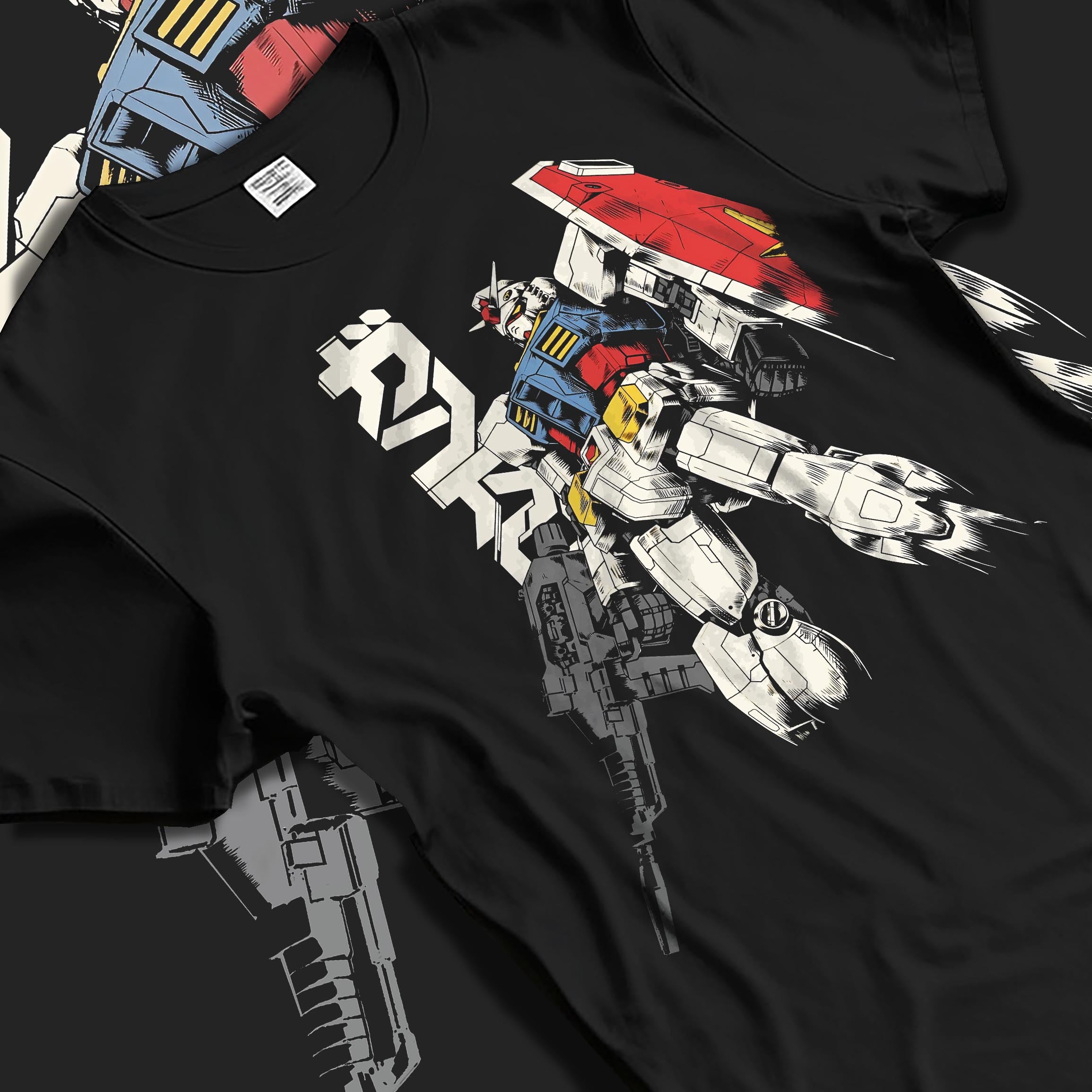 Black T-shirt laid flat with natural fabric folds, featuring Mobile Suit Gundam retro mecha anime artwork print styled with bold manga line art details.
