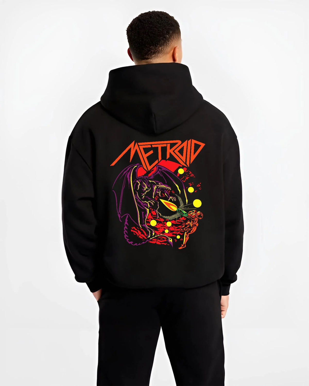 Black hoodie worn by male model from the back featuring Ryu Hadouken dragon energy artwork.
