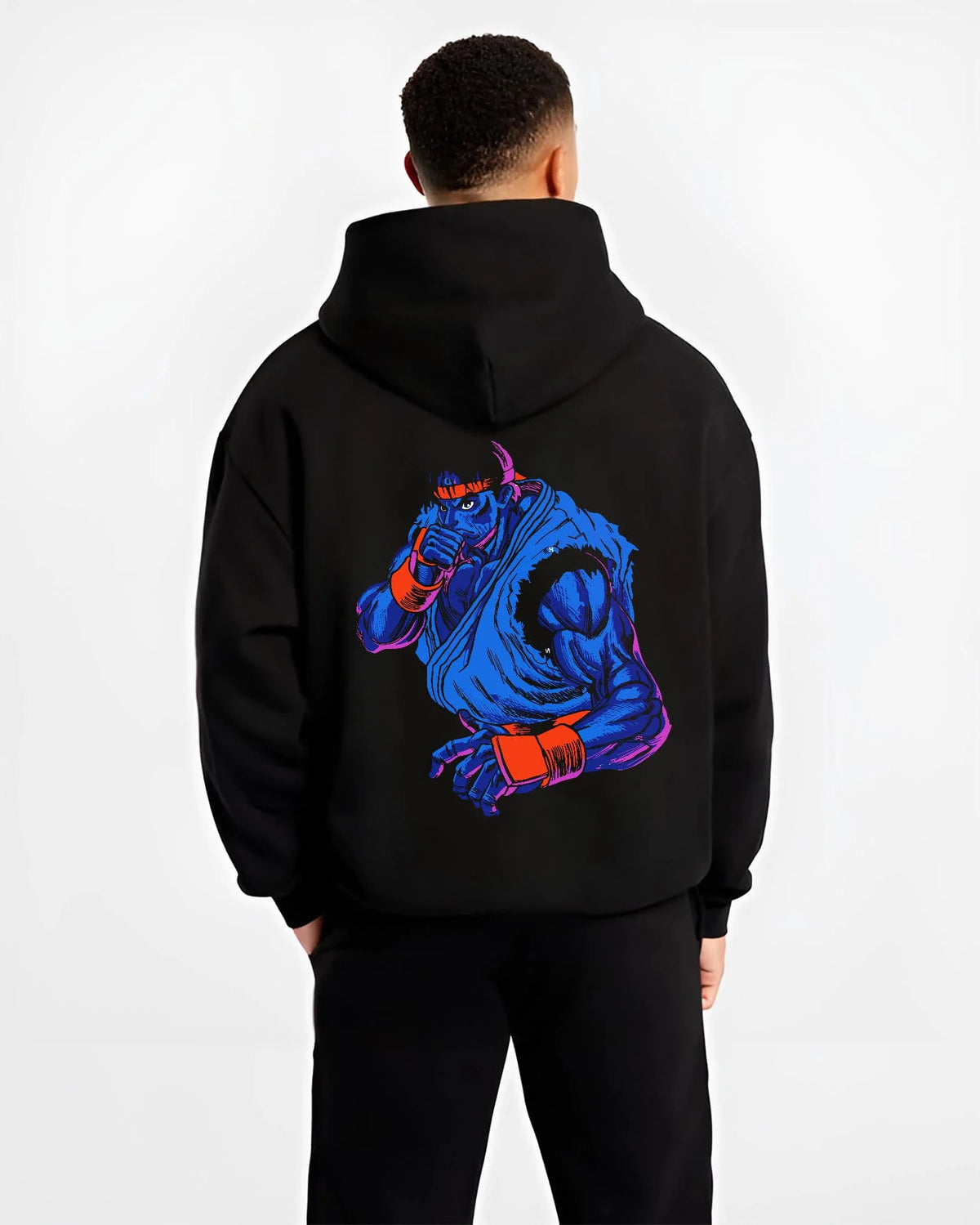 Black hoodie worn by male model from the back featuring Ryu blue gi Hadouken battle artwork.