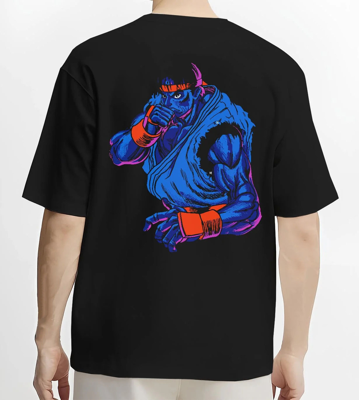 Black T-shirt worn by male model from the back featuring Ryu blue gi Hadouken battle artwork.
