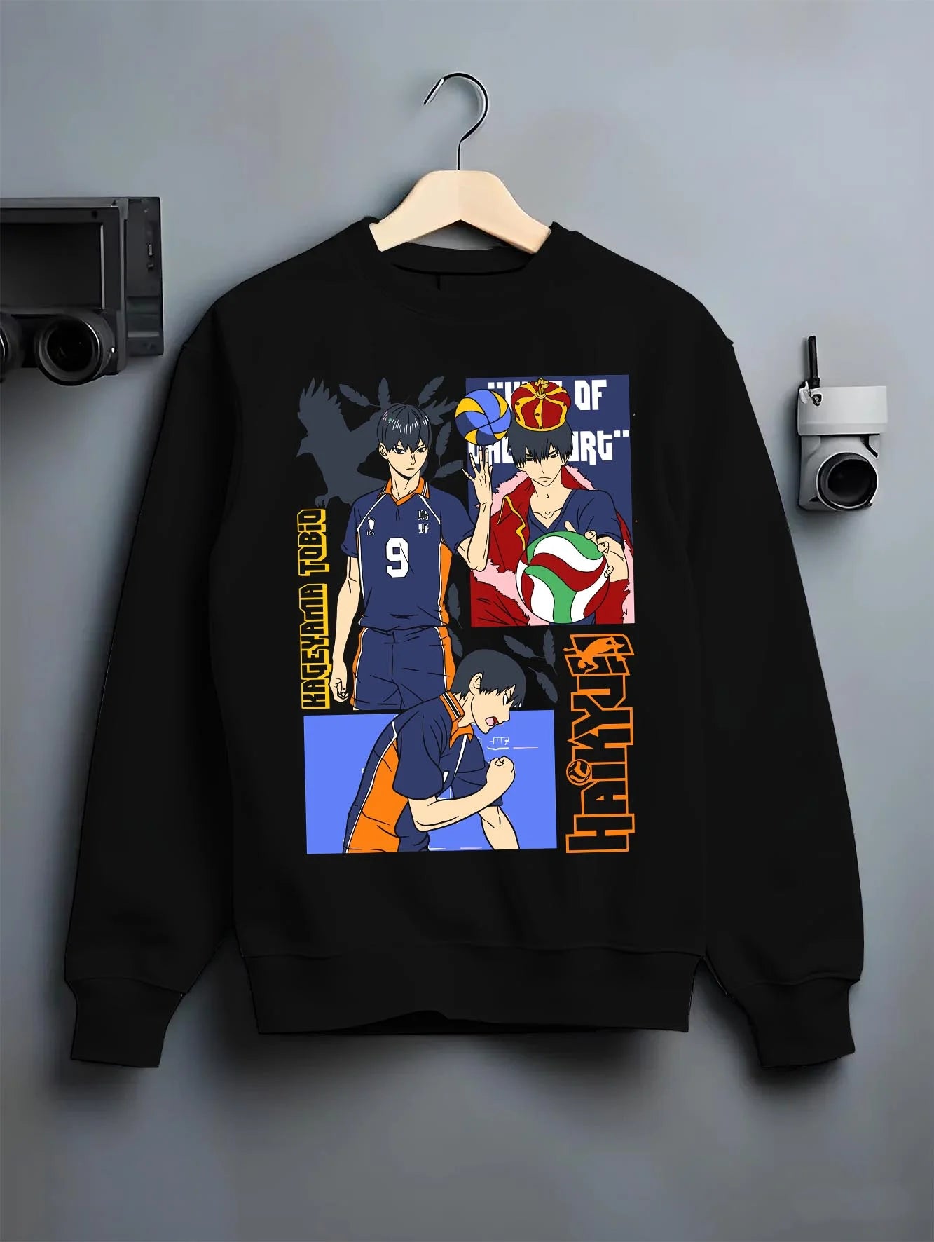 Black crewneck sweatshirt on hanger with Haikyuu Hoodie Tobio Kageyama Karasuno Club Jumper graphic premium wear.