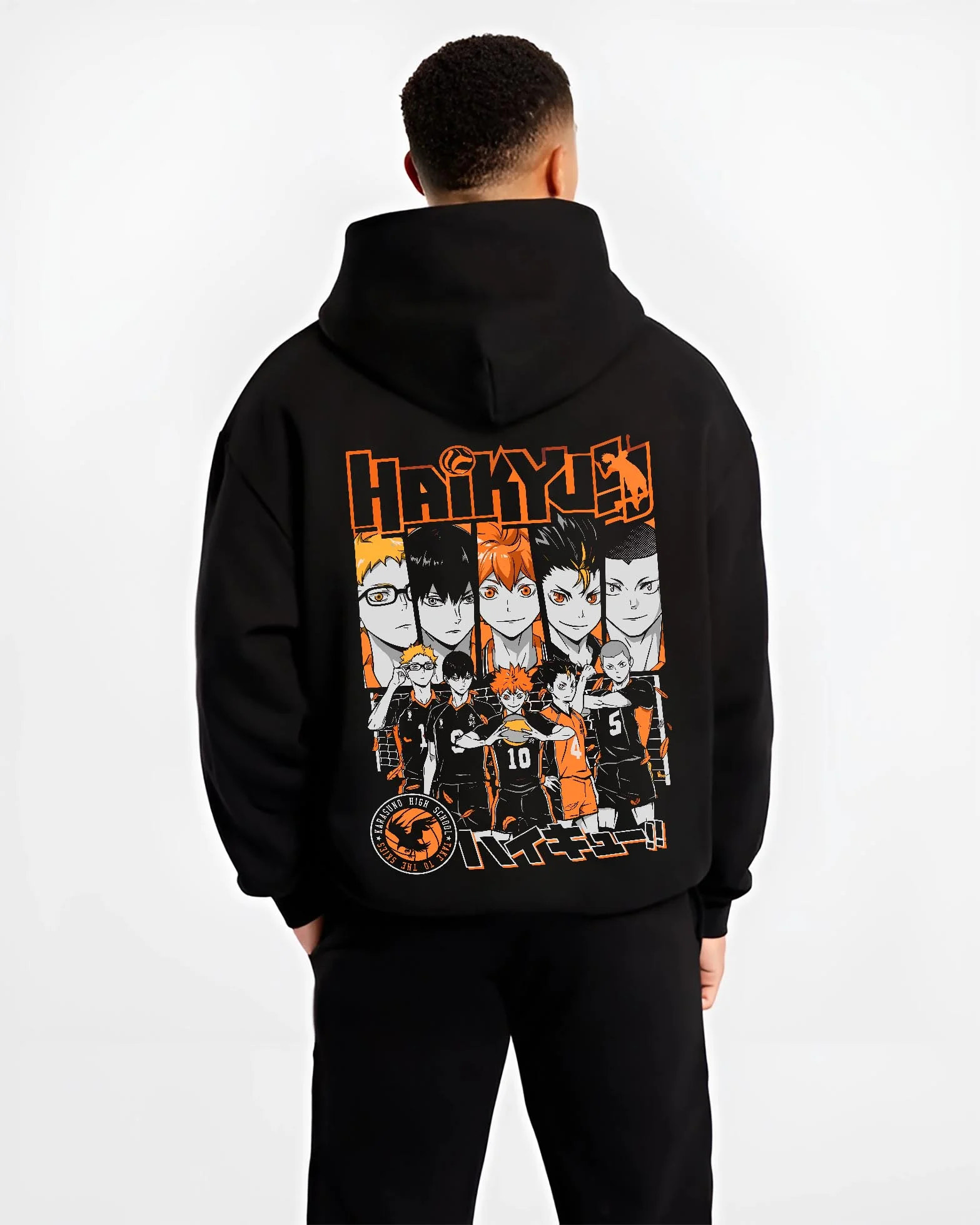 Black hoodie worn by male model, back view with Haikyuu Hoodie Shoyo Hinata Match Intense Jumper graphic bold anime graphic.