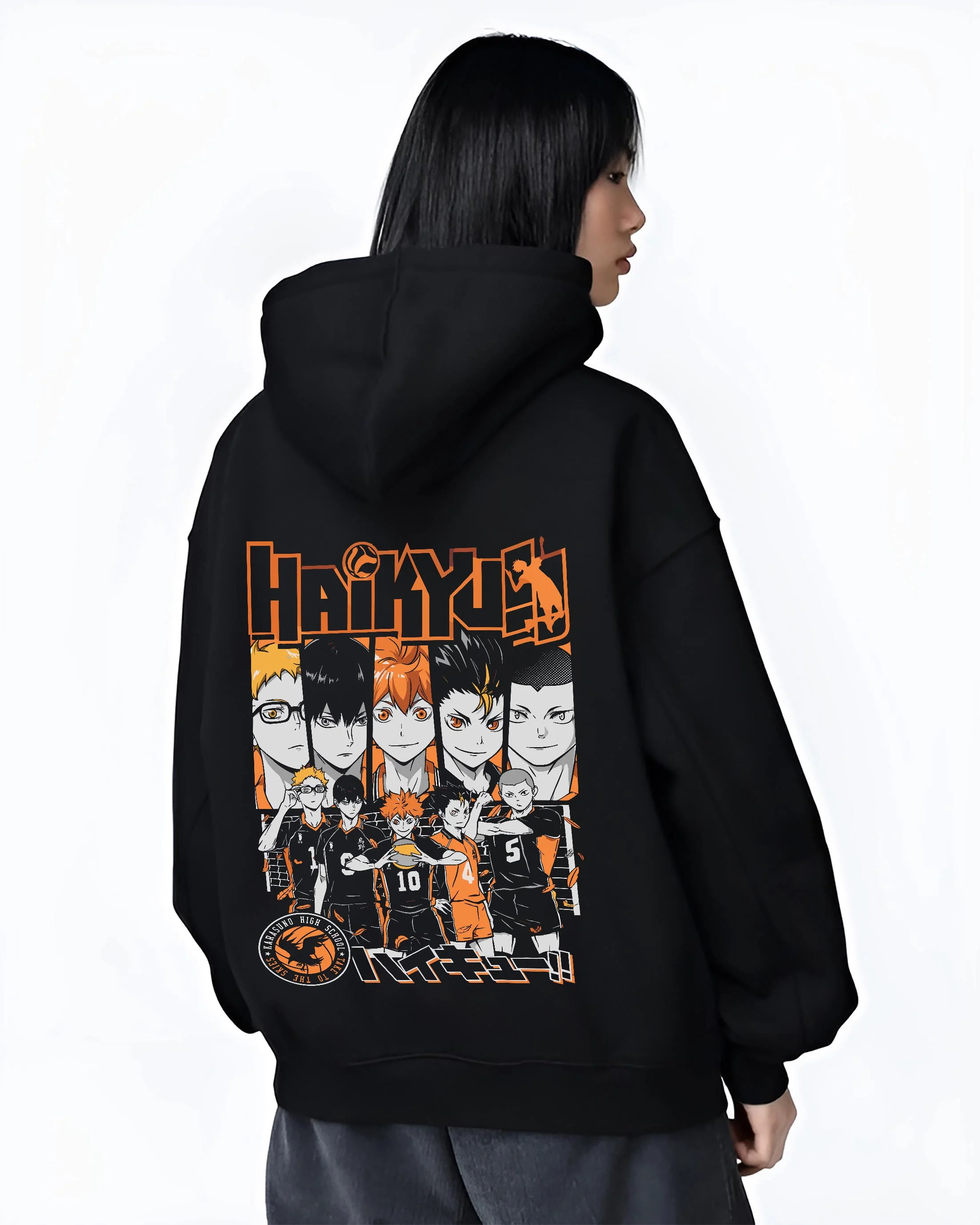 Black hoodie worn by female model, back view with Haikyuu Hoodie Shoyo Hinata Match Intense Jumper graphic bold anime graphic.