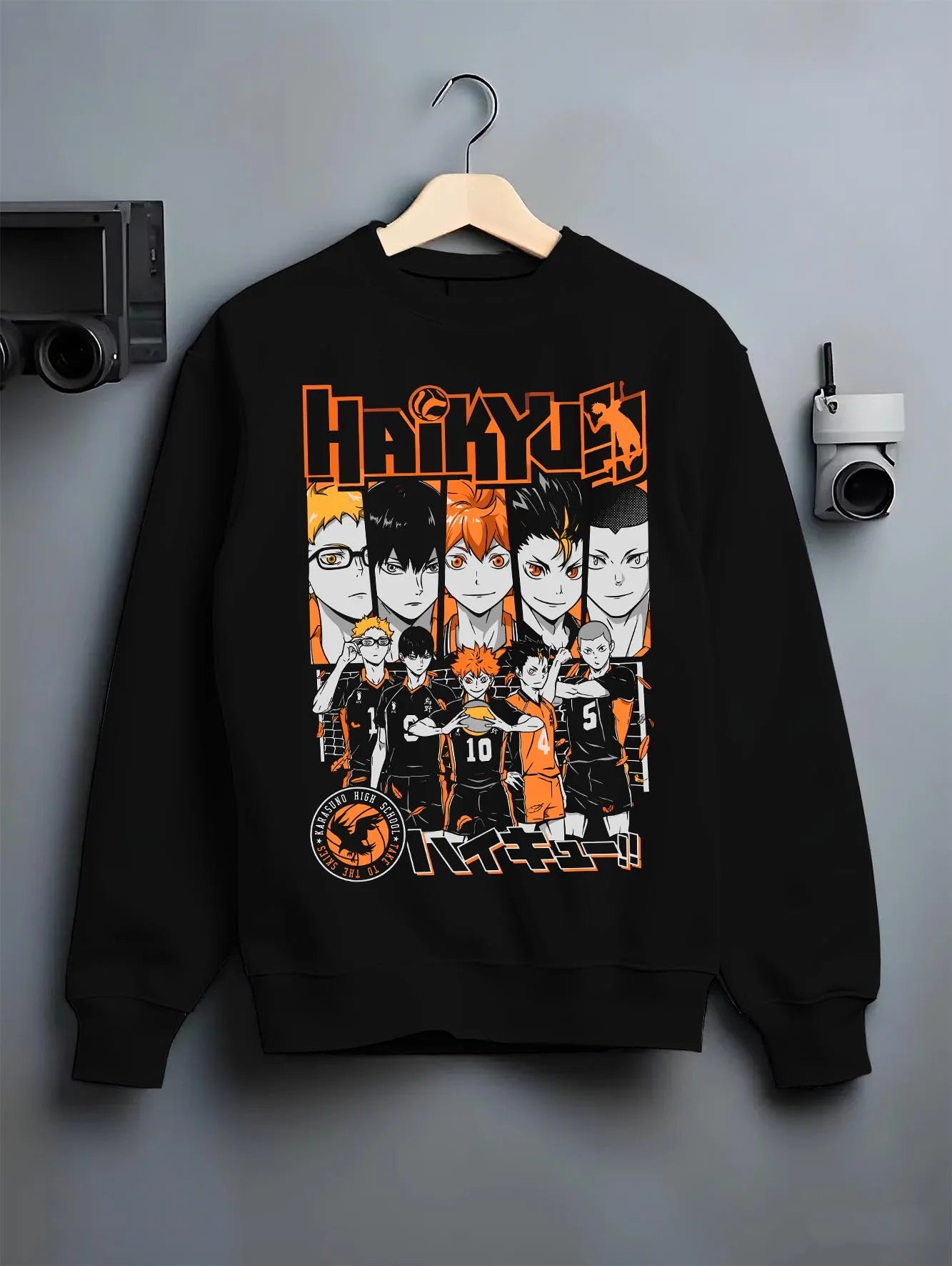 Black crewneck sweatshirt on hanger with Haikyuu Hoodie Shoyo Hinata Match Intense Jumper graphic premium wear.