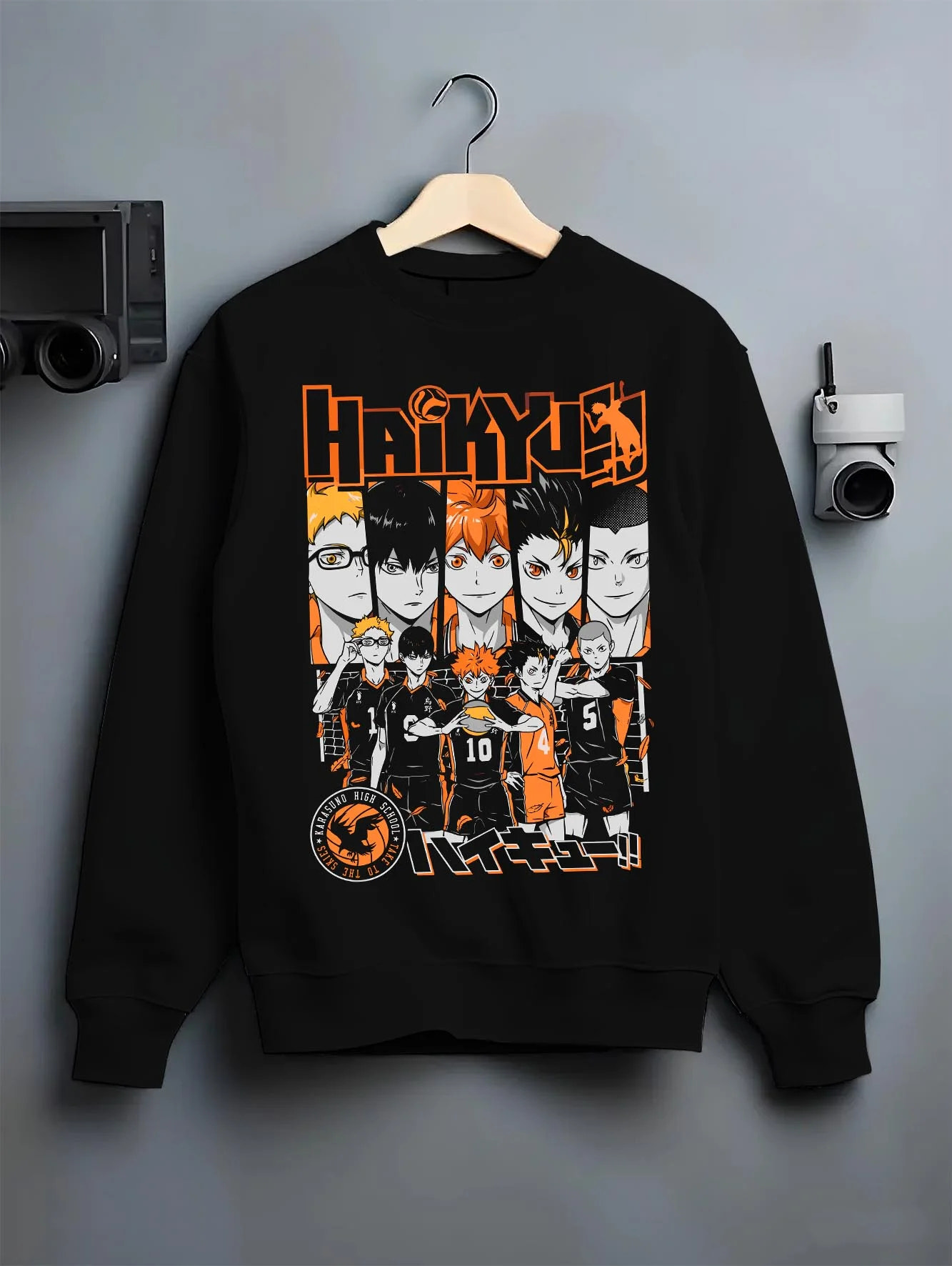 Black crewneck sweatshirt on hanger with Haikyuu Hoodie Shoyo Hinata Match Intense Jumper graphic premium wear.