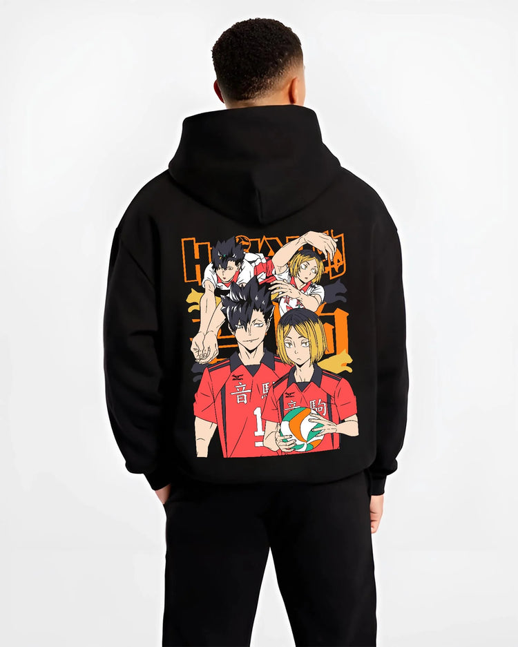 Black hoodie worn by male model, back view with Haikyuu Hoodie Nekoma vs Karasuno Rival Jumper graphic nan anime design.
