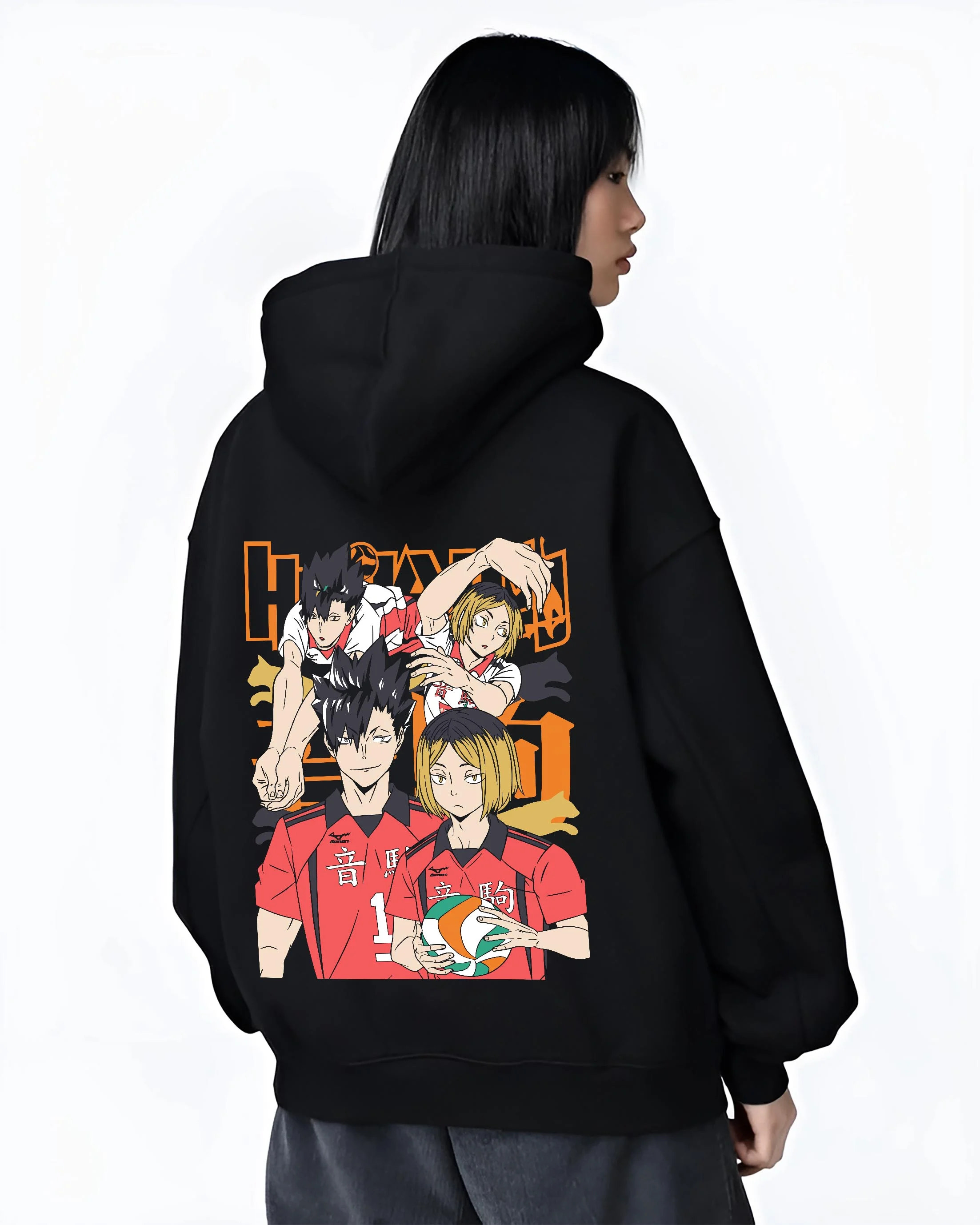 Black hoodie worn by female model, back view with Haikyuu Hoodie Nekoma vs Karasuno Rival Jumper graphic streetwear graphic.