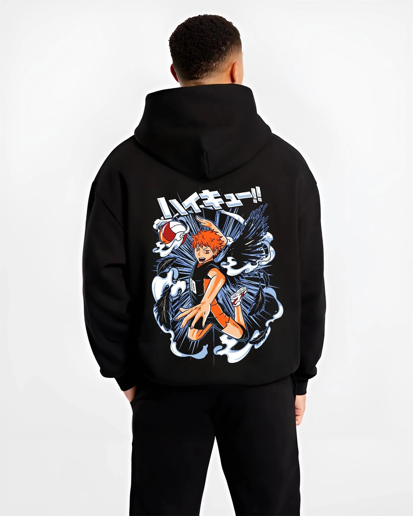 Black hoodie worn by male model, back view with Haikyuu Hoodie Shoyo Hinata Action Jump Jumper graphic bold anime graphic.