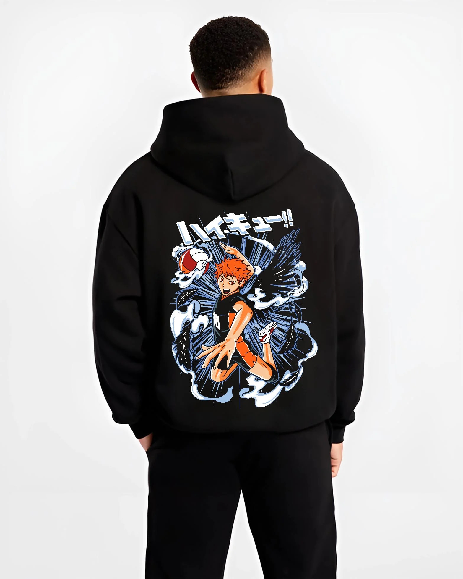 Black hoodie worn by male model, back view with Haikyuu Hoodie Shoyo Hinata Action Jump Jumper graphic bold anime graphic.