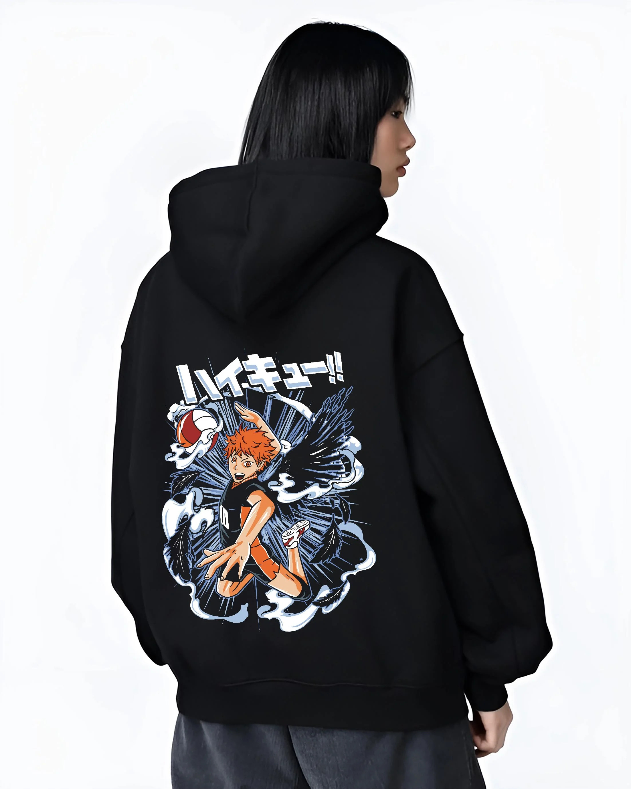 Black hoodie worn by female model, back view with Haikyuu Hoodie Shoyo Hinata Action Jump Jumper graphic bold anime graphic.