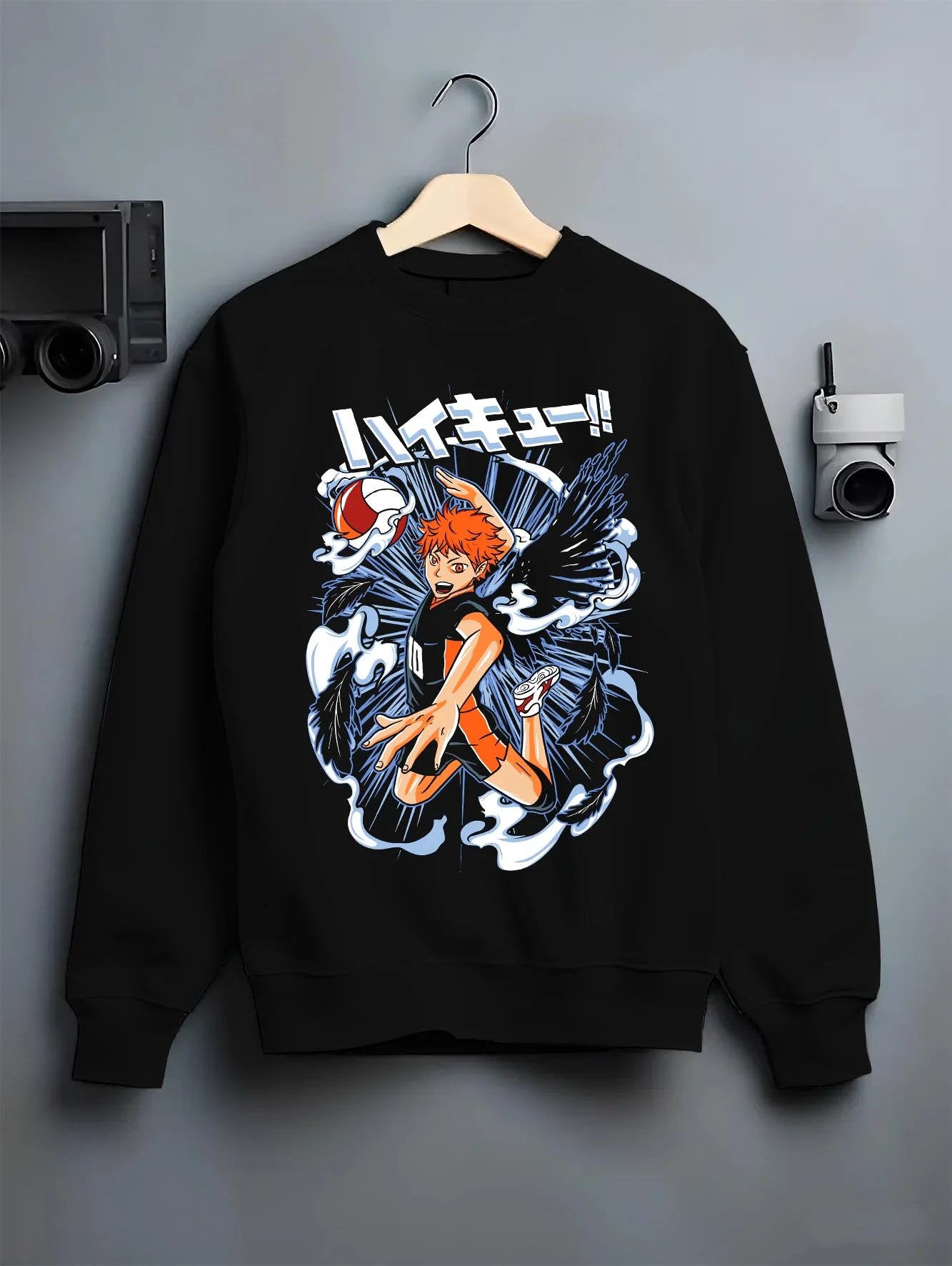 Black crewneck sweatshirt on hanger with Haikyuu Hoodie Shoyo Hinata Action Jump Jumper graphic bold anime graphic.