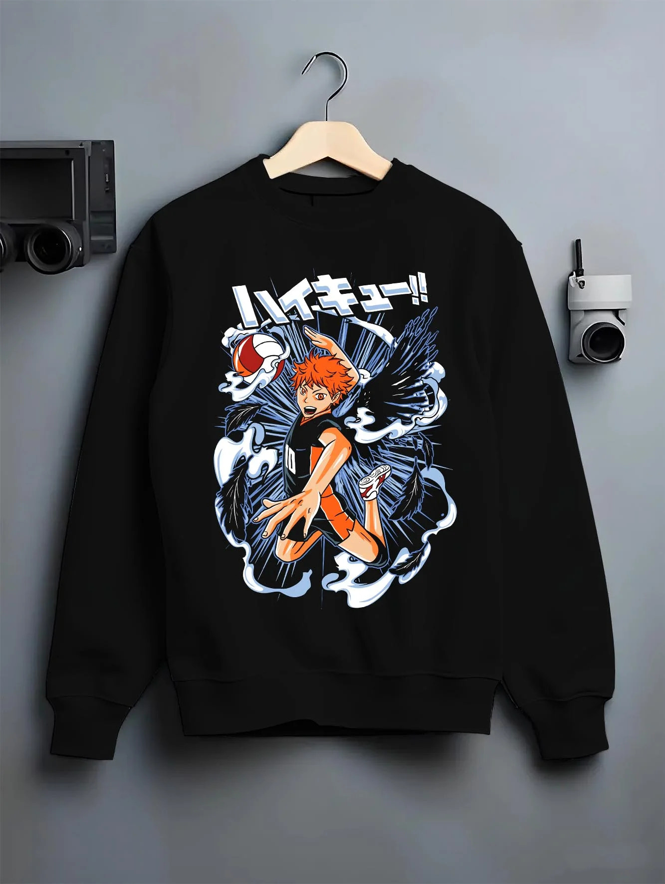 Black crewneck sweatshirt on hanger with Haikyuu Hoodie Shoyo Hinata Action Jump Jumper graphic bold anime graphic.