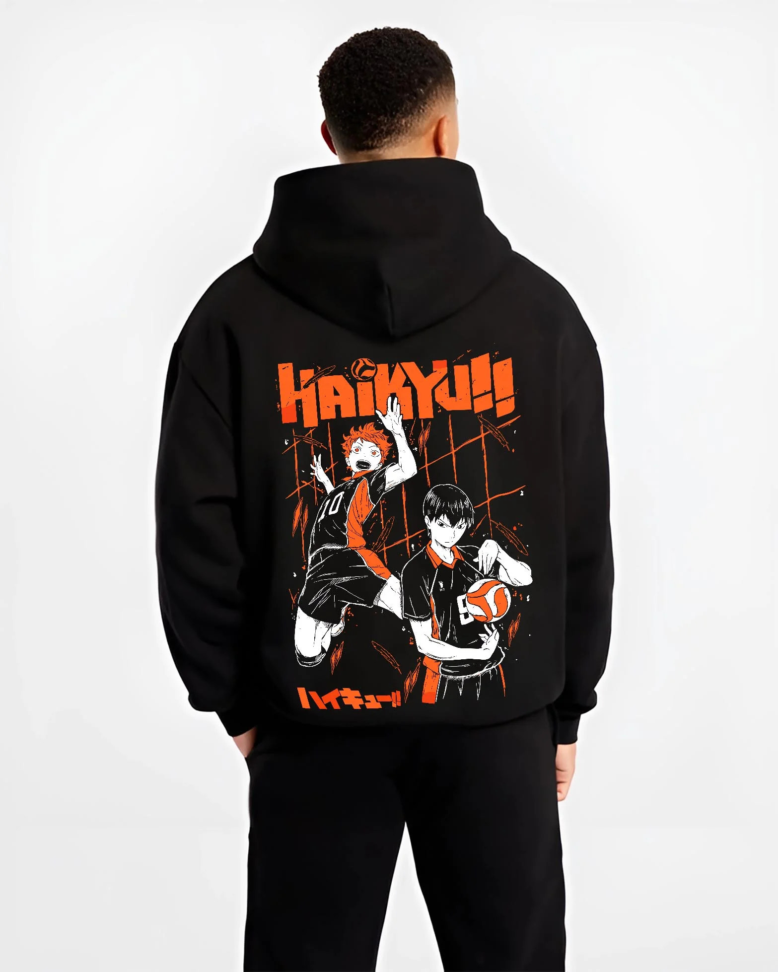 Black hoodie worn by male model, back view with Haikyuu Hoodie Shoyo Hinata Tobio Kageyama Jumper graphic premium wear.