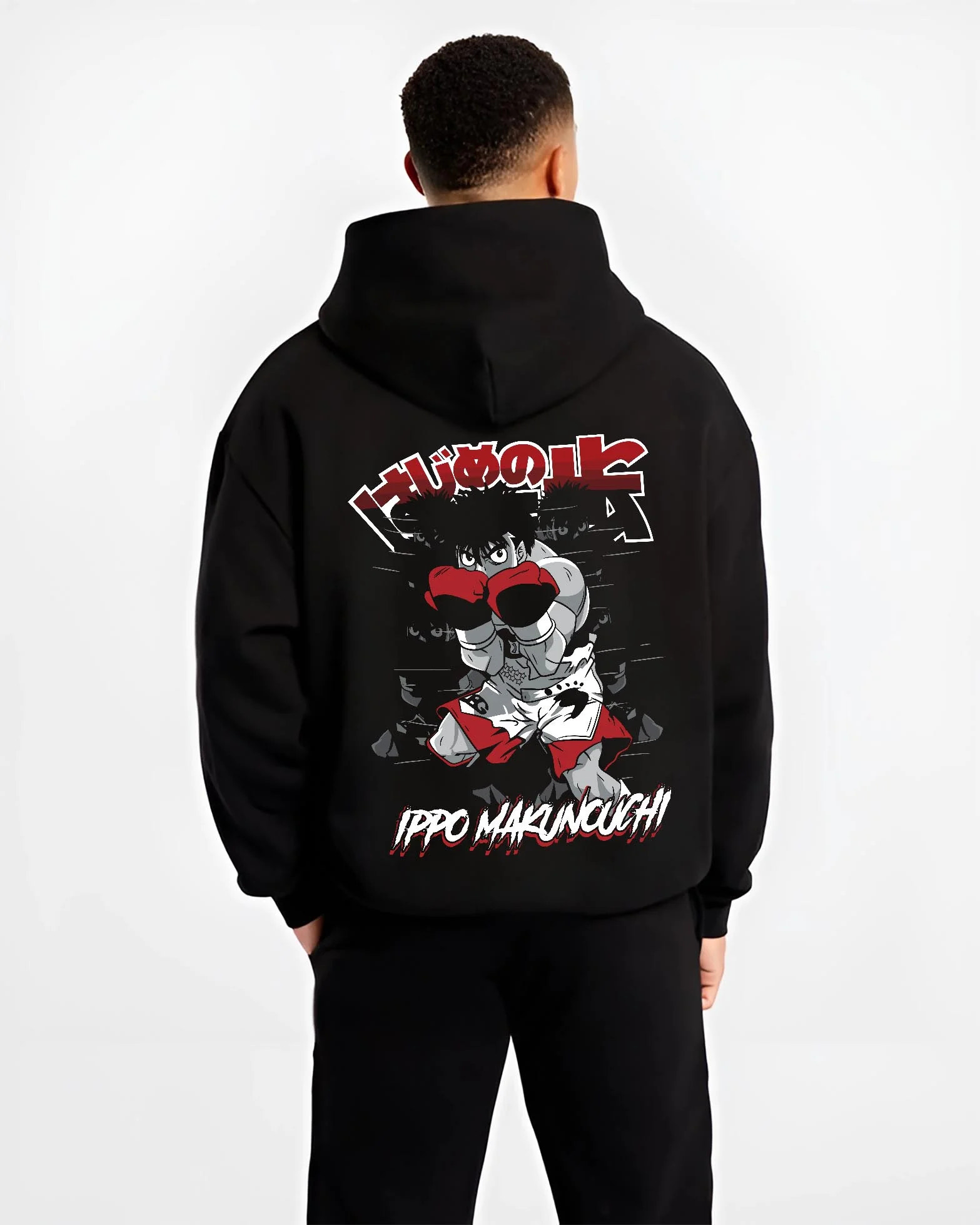 Black hoodie worn by male model, back view with Hajime no Ippo Hoodie Ippo Makunouchi Determined graphic streetwear graphic.