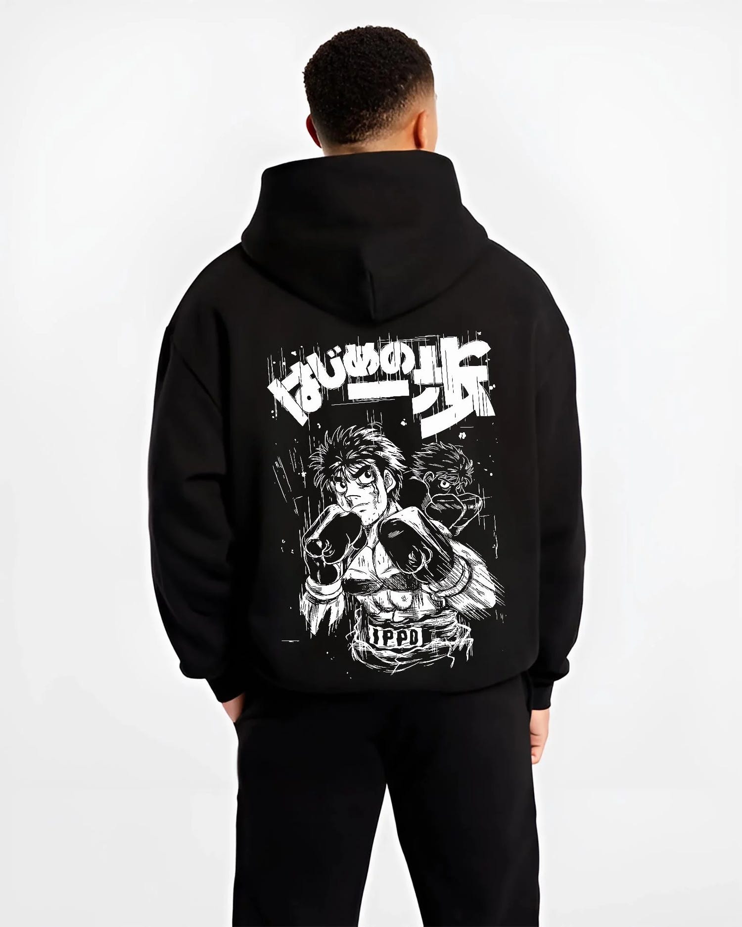 Black hoodie worn by male model, back view with Hajime no Ippo Hoodie Ippo Makunouchi Fighting Spirit graphic premium wear.