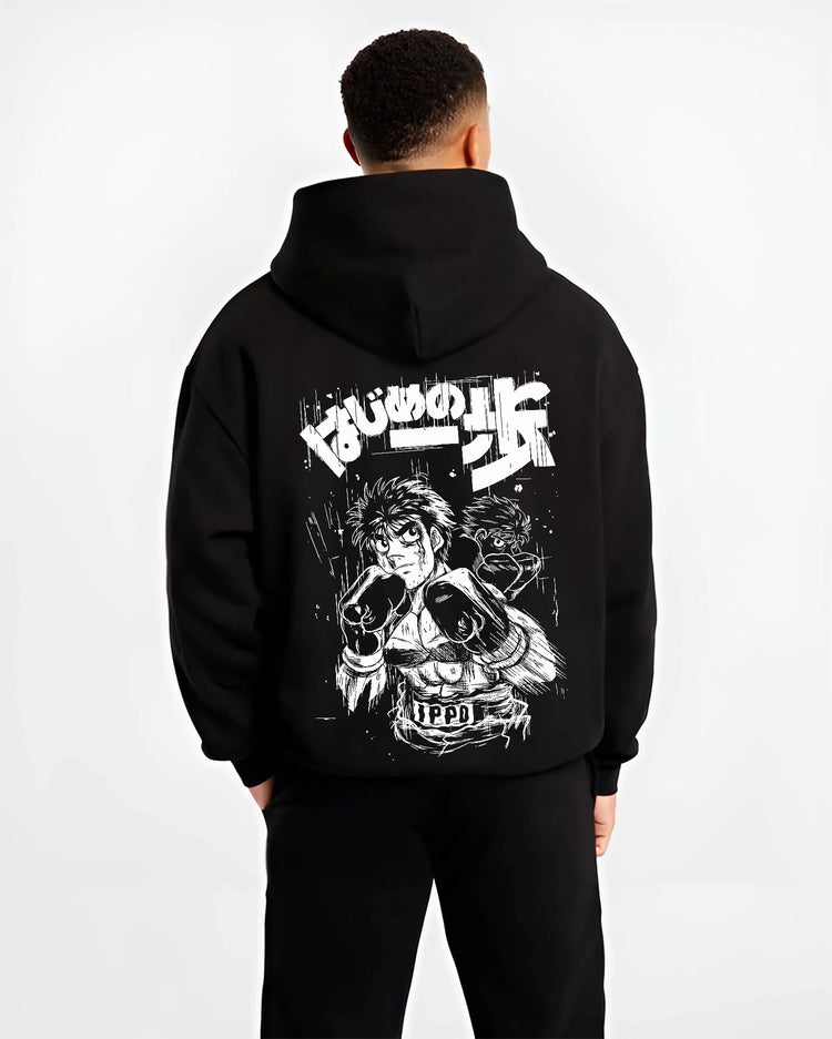 Black hoodie worn by male model, back view with Hajime no Ippo Hoodie Ippo Makunouchi Fighting Spirit graphic premium wear.