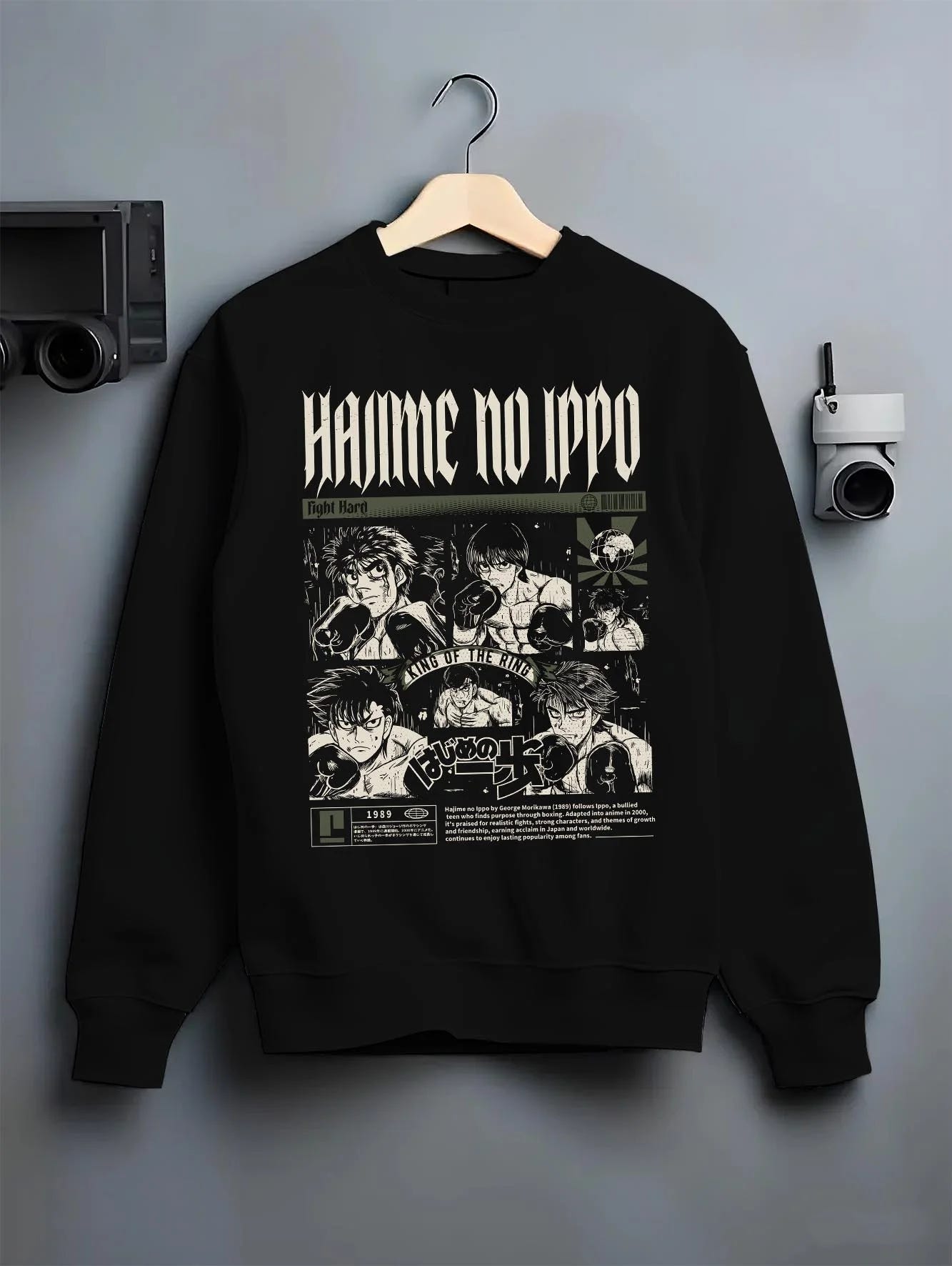 Black crewneck sweatshirt on hanger with Hajime no Ippo Hoodie Ippo Makunouchi Boxing Power graphic streetwear graphic.
