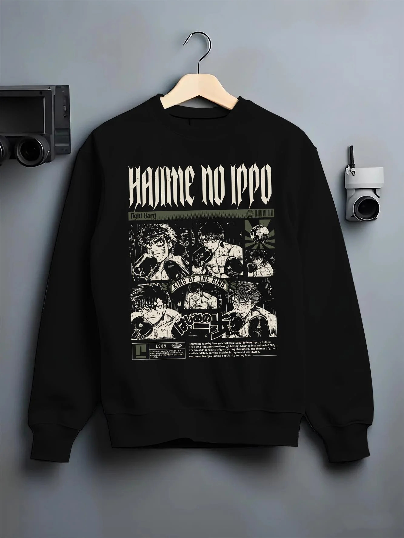 Black crewneck sweatshirt on hanger with Hajime no Ippo Hoodie Ippo Makunouchi Boxing Power graphic streetwear graphic.