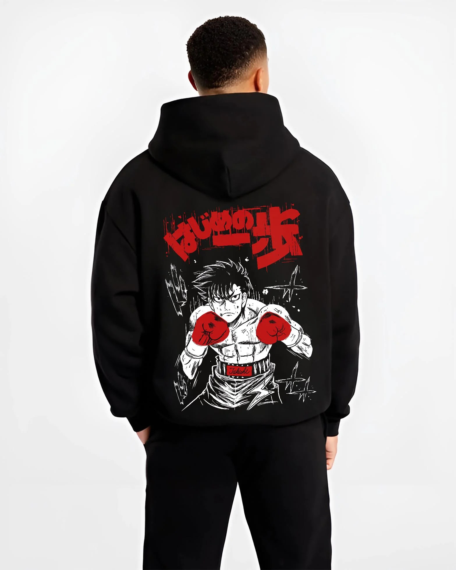 Black hoodie worn by male model, back view with Hajime no Ippo Hoodie Ippo Makunouchi Fierce Match graphic premium wear.