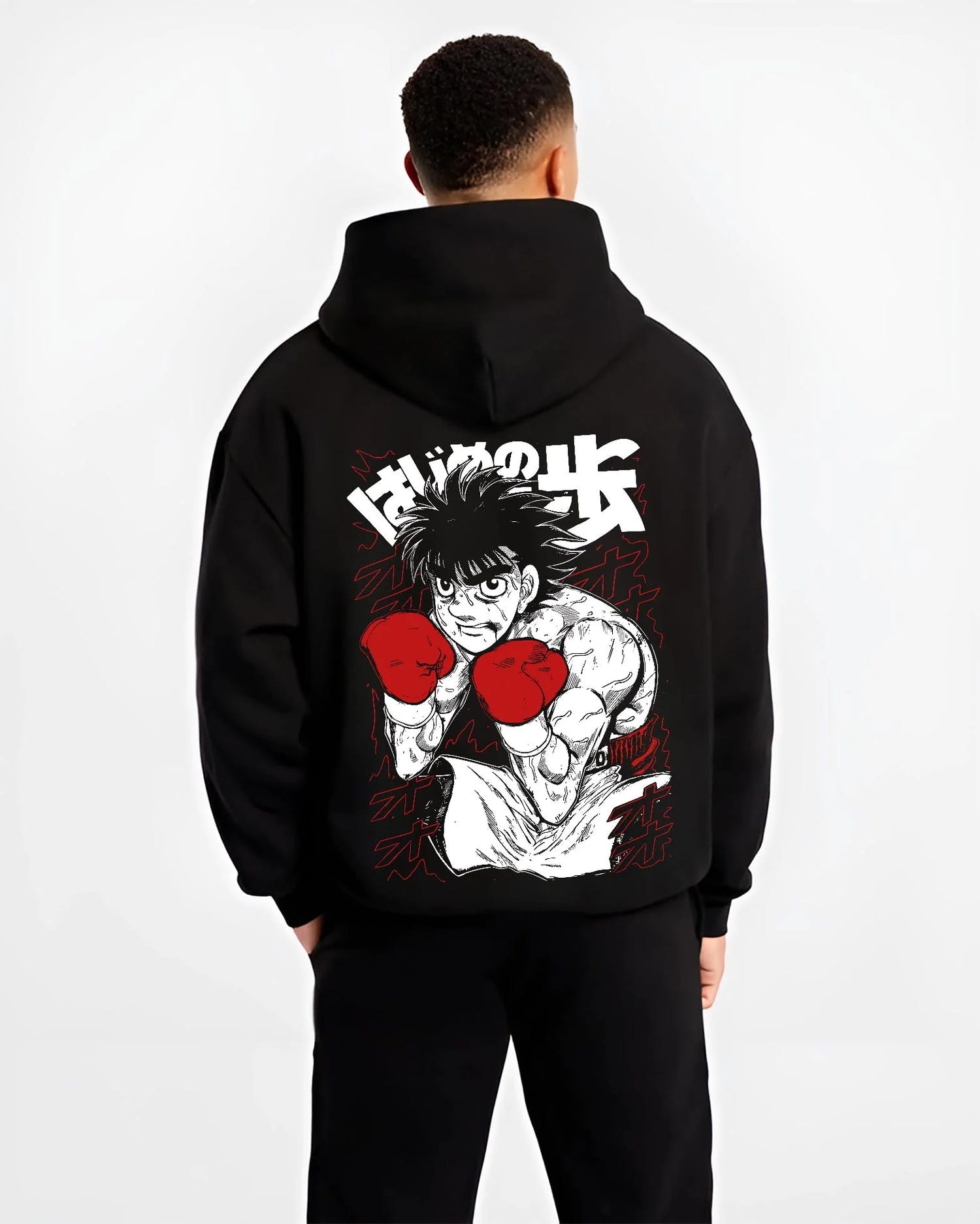 Black hoodie worn by male model, back view with Hajime no Ippo Hoodie Ippo Makunouchi Strong Punch graphic bold anime graphic.