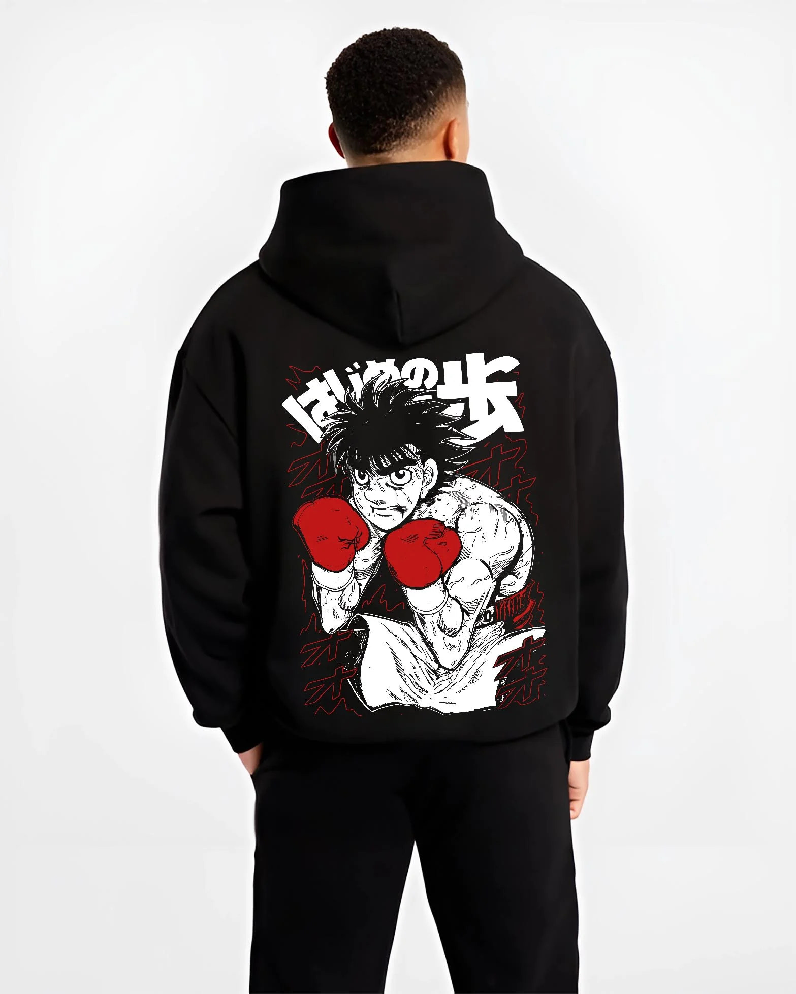 Black hoodie worn by male model, back view with Hajime no Ippo Hoodie Ippo Makunouchi Strong Punch graphic bold anime graphic.