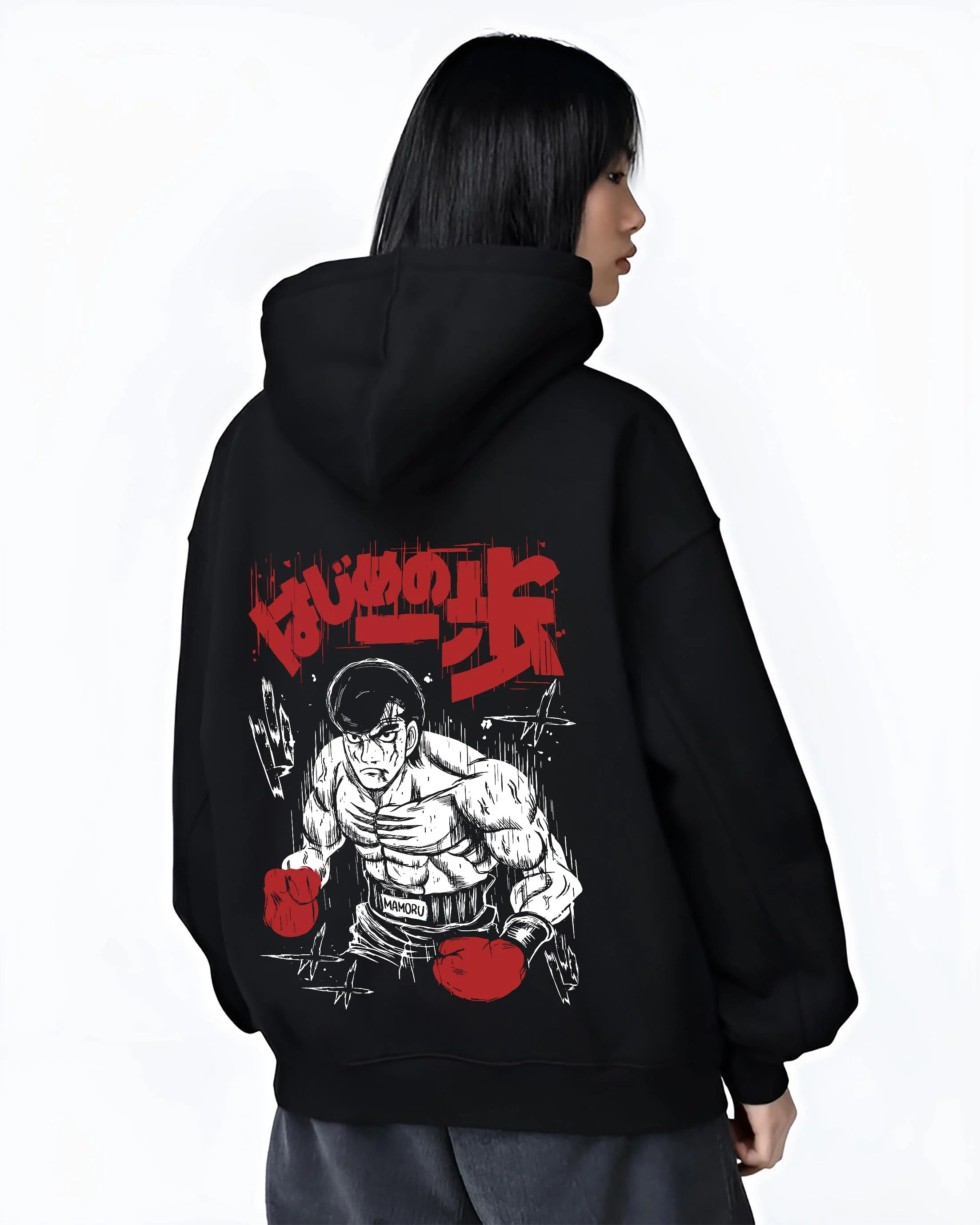 Black hoodie worn by female model, back view with Hajime no Ippo Hoodie Ippo Makunouchi Training Jumper graphic bold anime graphic.