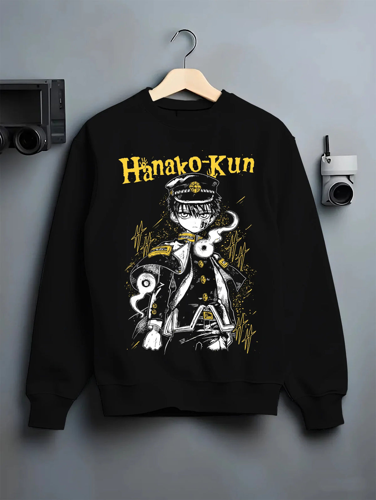 Black crewneck sweatshirt on hanger showing Hanako-kun from Toilet-Bound Hanako-kun: black-and-gold school uniform portrait