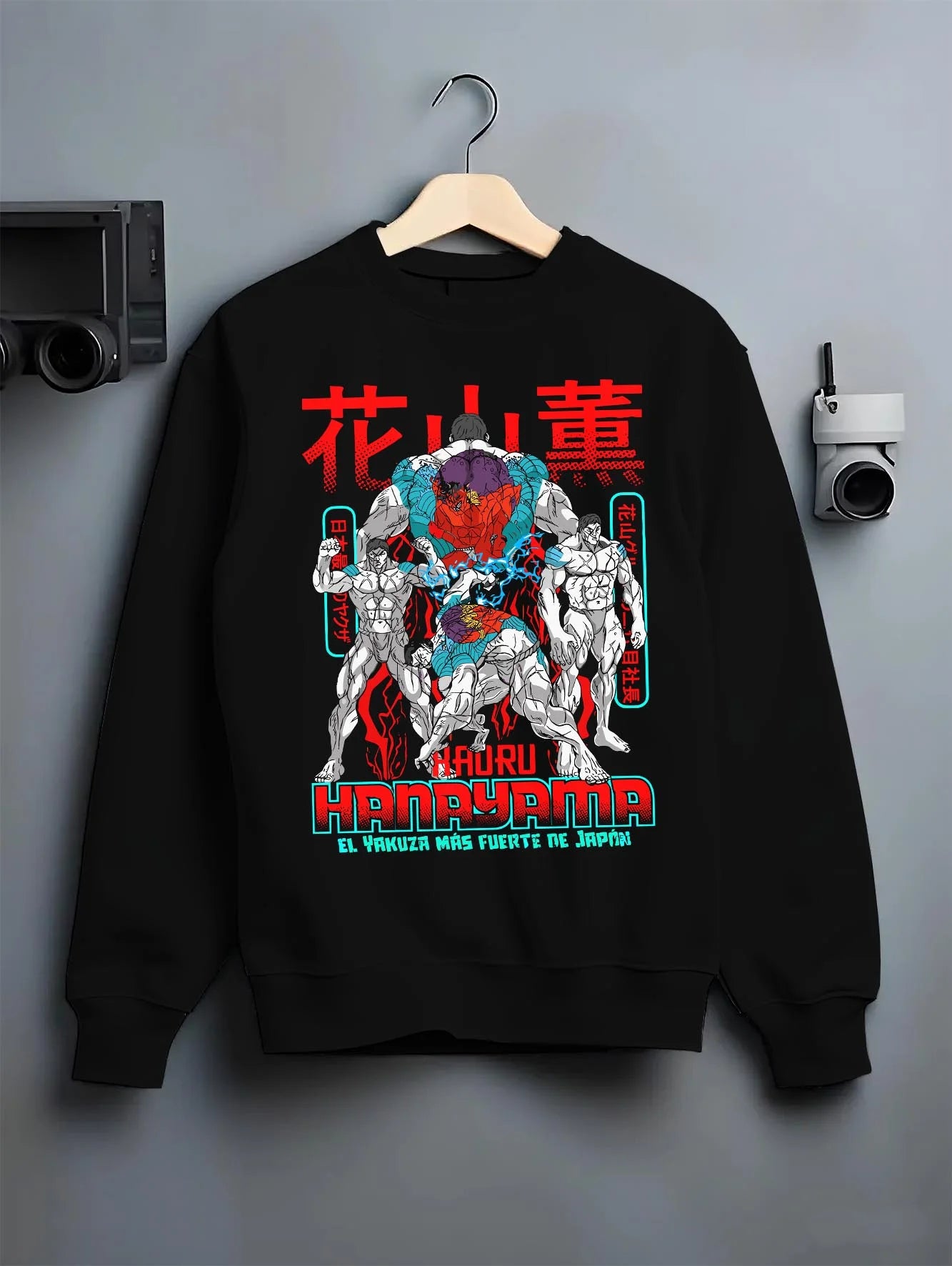 Black crewneck sweatshirt on hanger with Kengan Ashura Hoodie Kaoru Hanayama Power Jumper graphic premium wear.