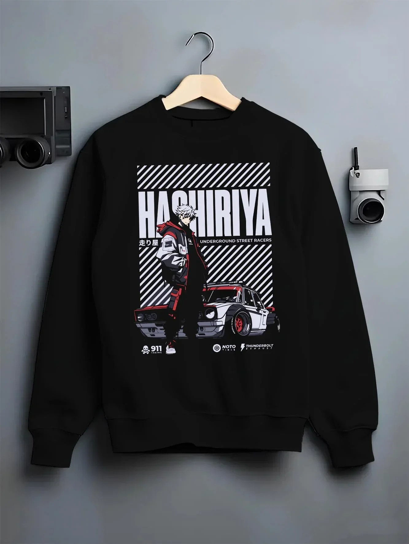 Black crewneck sweatshirt on a hanger against a grey wall, feBlack crewneck sweatshirt on a hangBlack crewneck sweatshirt on a hanger against a grey wall, featuring ACURA NSX turbo race street racing performance graphic.Black crewneck sweatshirt on a hanger against a grey wall, featuring Dodge Charger muscle retro racing street performance graphic.er against a grey wall, featuring Volkswagen Beetle racing classic legend street graphic.aturing rs race drift jdm tokyo street underground racing graphic.