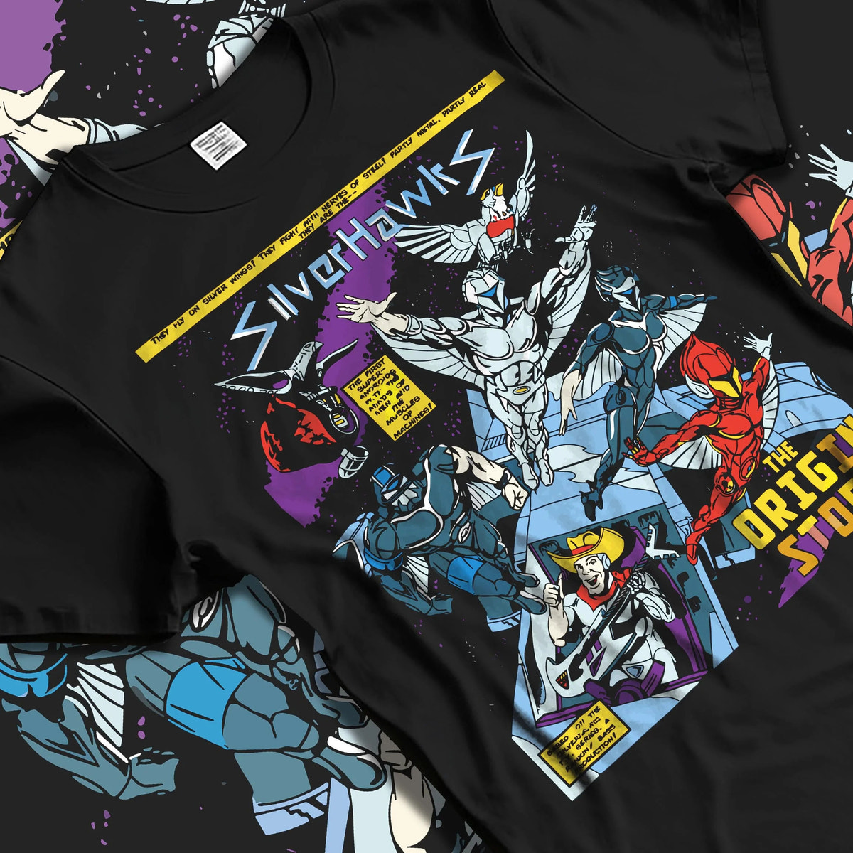 Black T-shirt laid flat with natural folds featuring SilverHawks origin story team artwork.