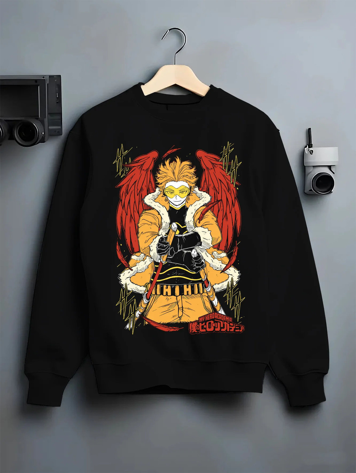 Black crewneck sweatshirt on hanger showing Keigo Takami / Hawks from My Hero Academia: winged hero in yellow jacket