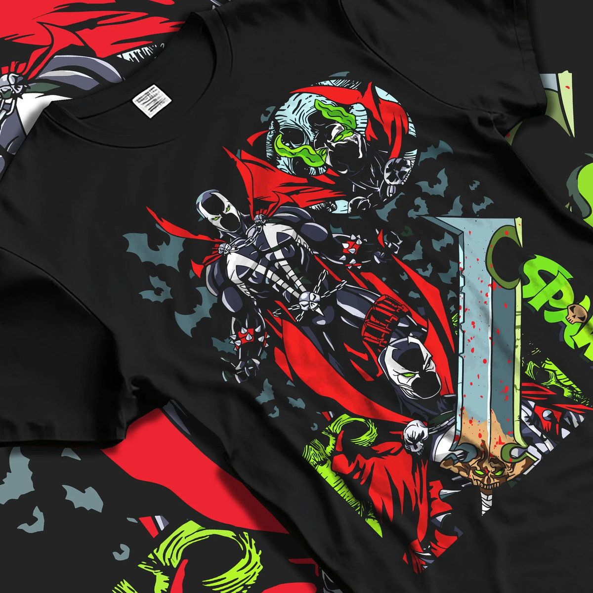 Black T-shirt laid flat with natural folds featuring Spawn Hellspawn chains dark antihero artwork.