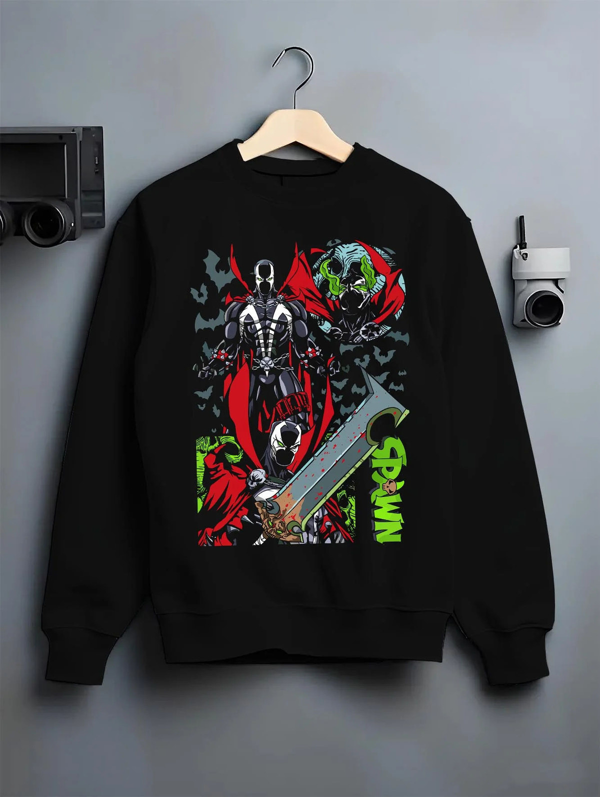 Black crewneck sweatshirt on hanger featuring Spawn Hellspawn chains dark antihero artwork.