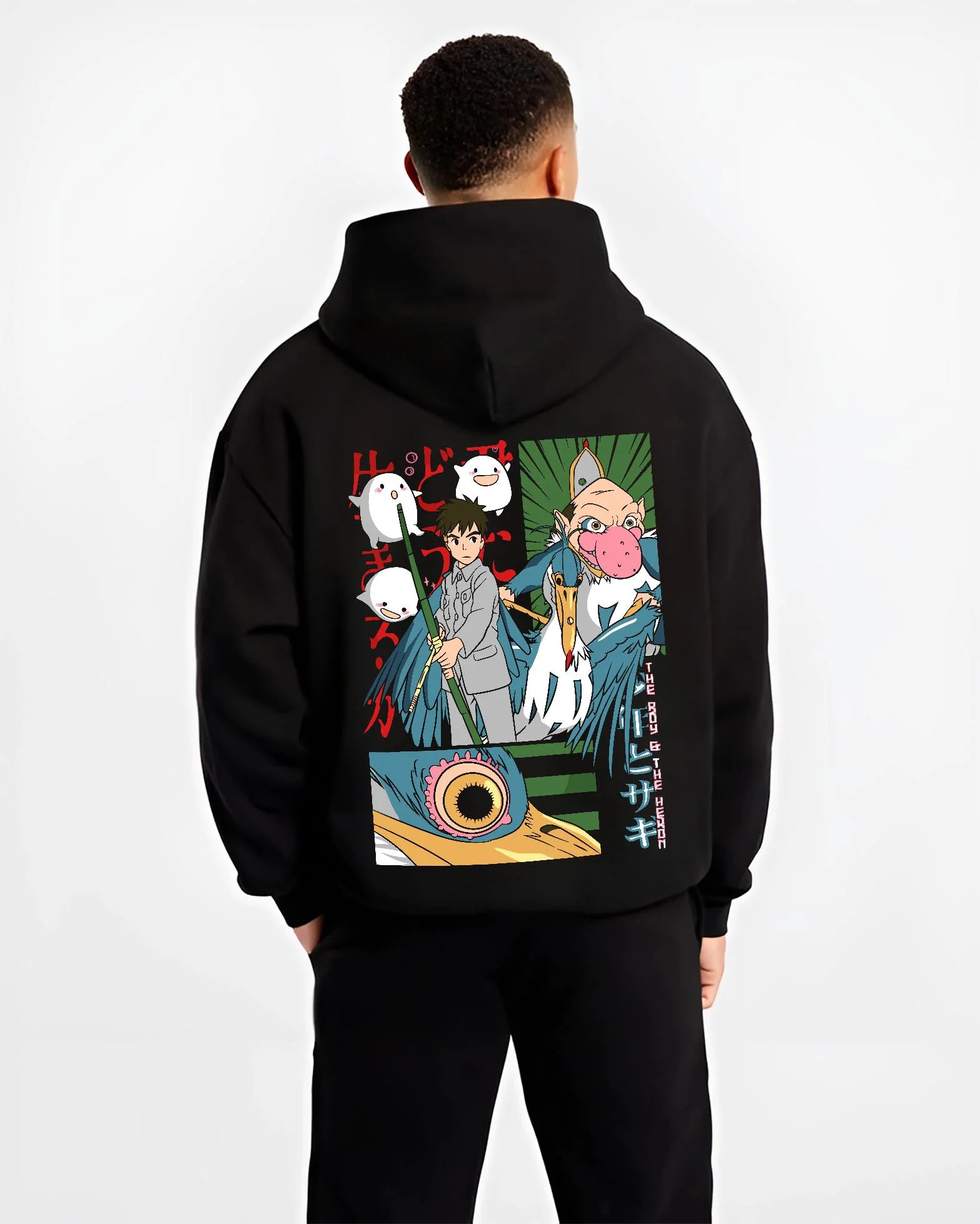 Black hoodie worn by male model, back view with The Boy And The Heron Hoodie Studio Ghibli Movie graphic bold anime graphic.